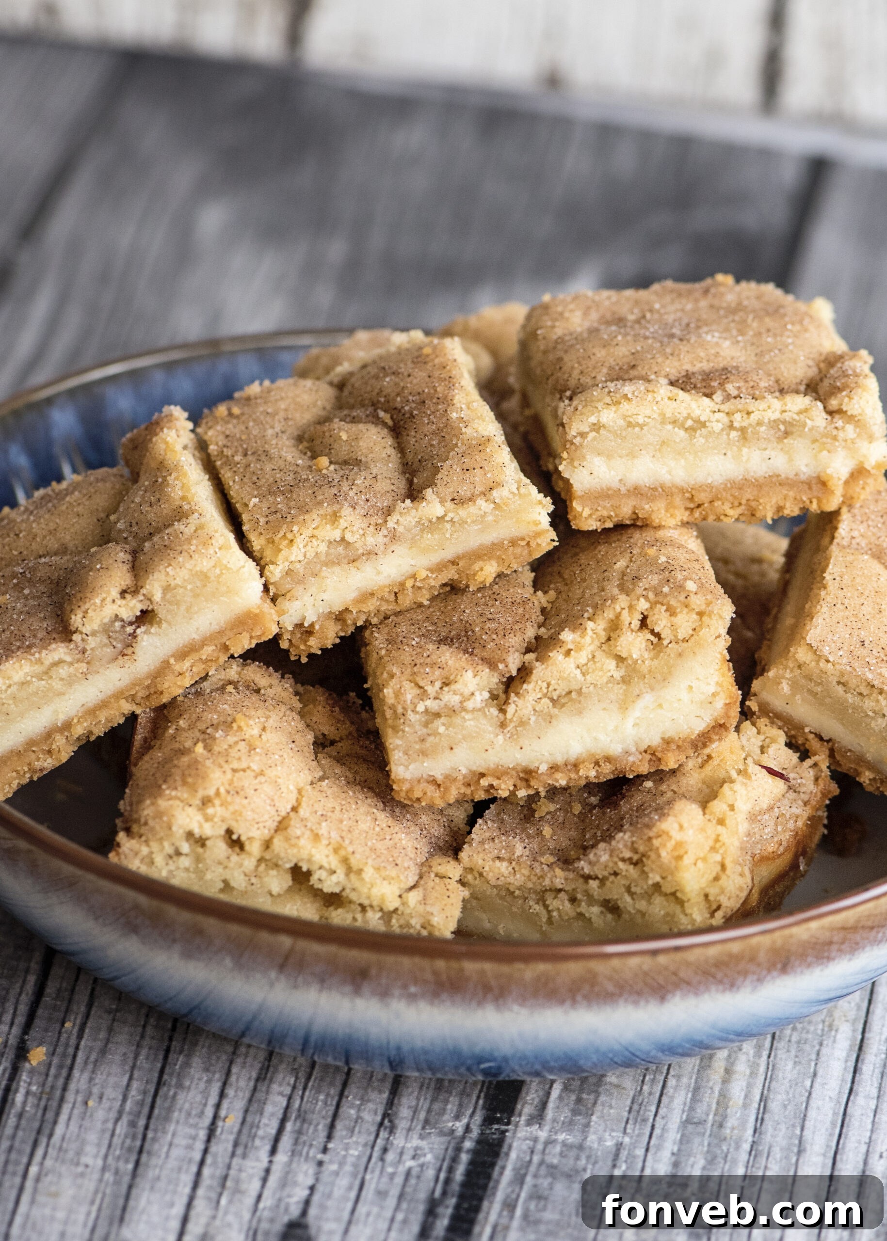 Baking pan lined with aluminum foil, ready for Snickerdoodle Cheesecake Bar layers