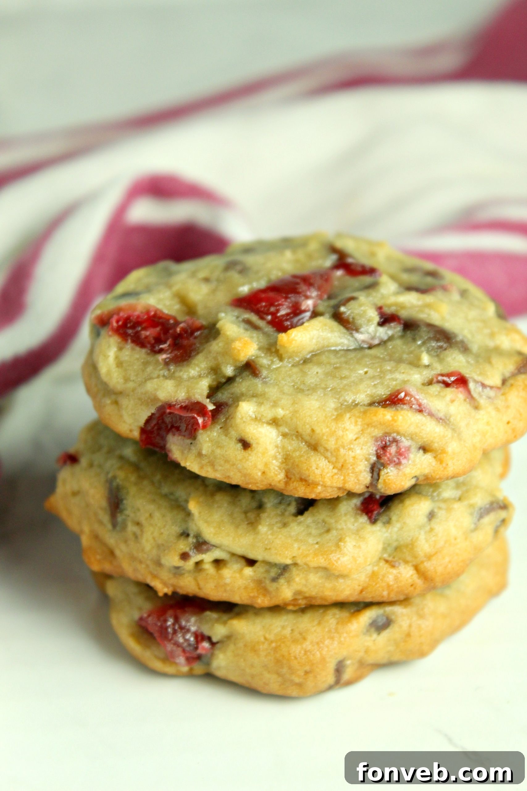 Raw Cherry Garcia Cookie dough balls on a parchment-lined baking sheet, ready for the oven