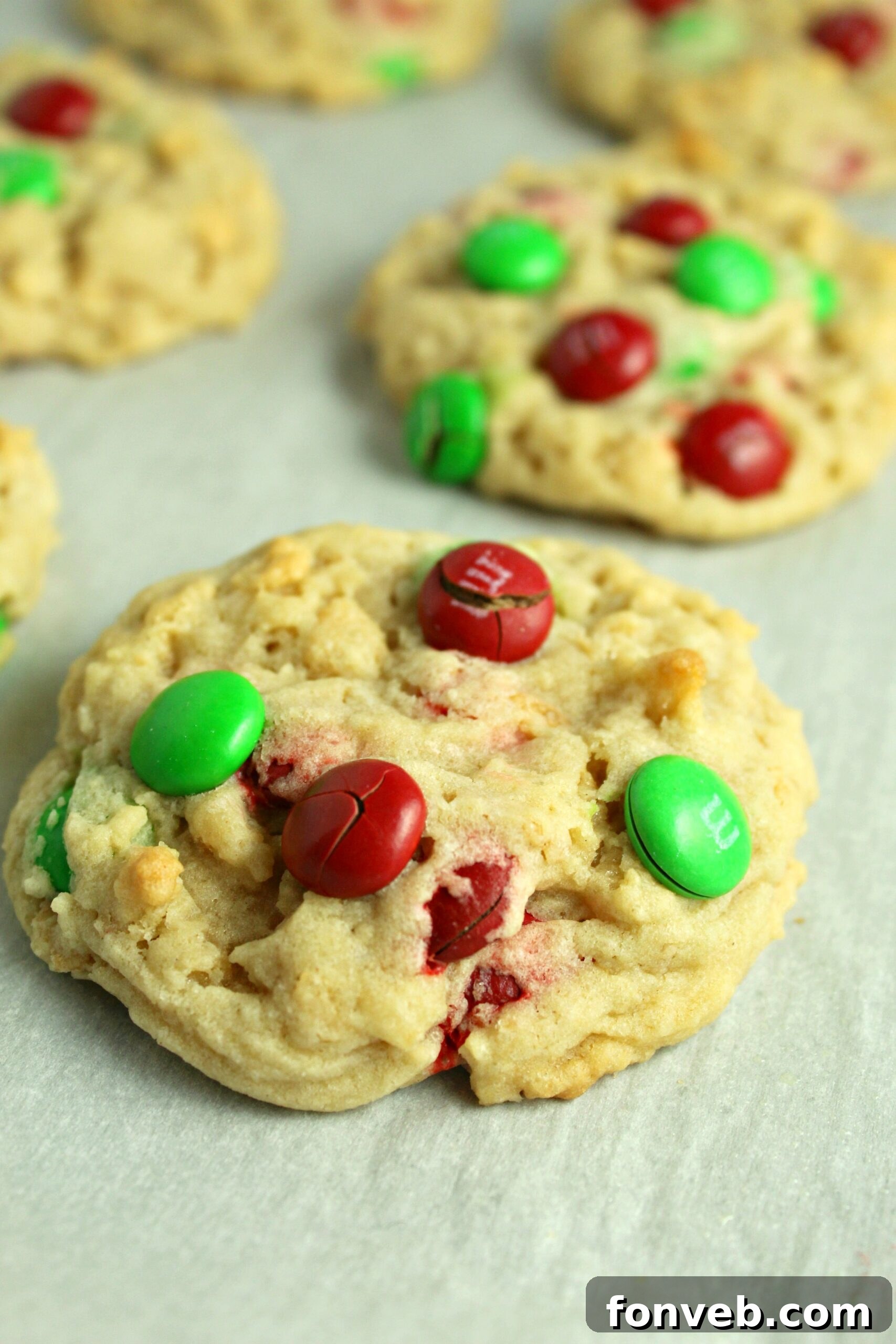 Delicious Rice Krispie M&M Cookies on a baking sheet, ready for holiday festivities.