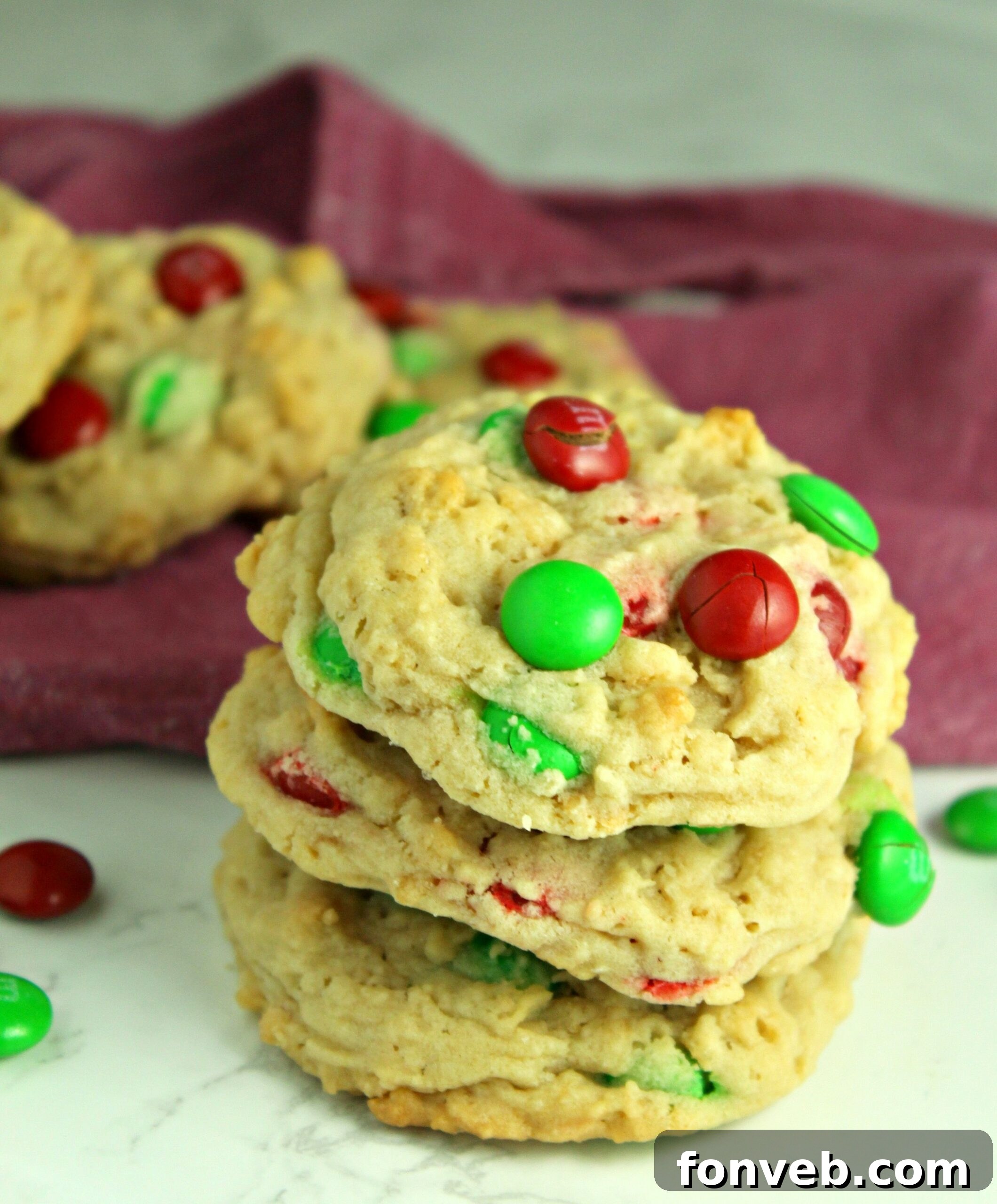 Rice Krispie M&M Cookies neatly arranged in a rustic holiday gift basket.