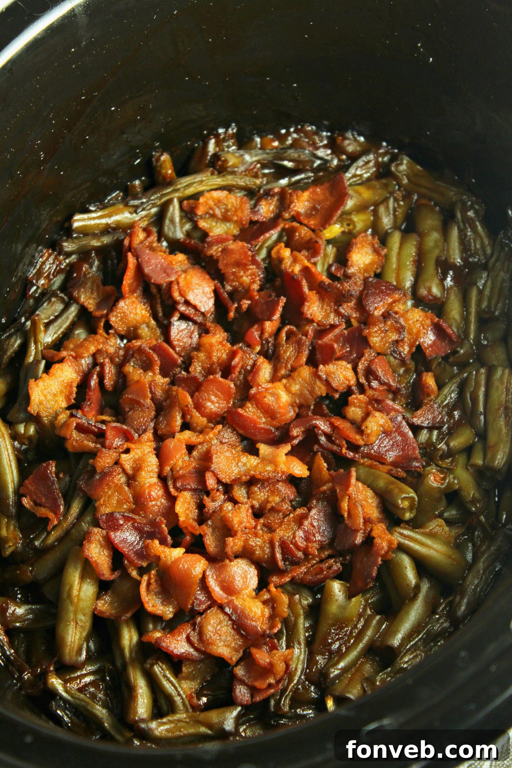 Hearty Slow Cooker Smothered BBQ Green Beans 3 Slow Cooker Smothered Barbecue Green Beans cooked to perfection, ready to be served