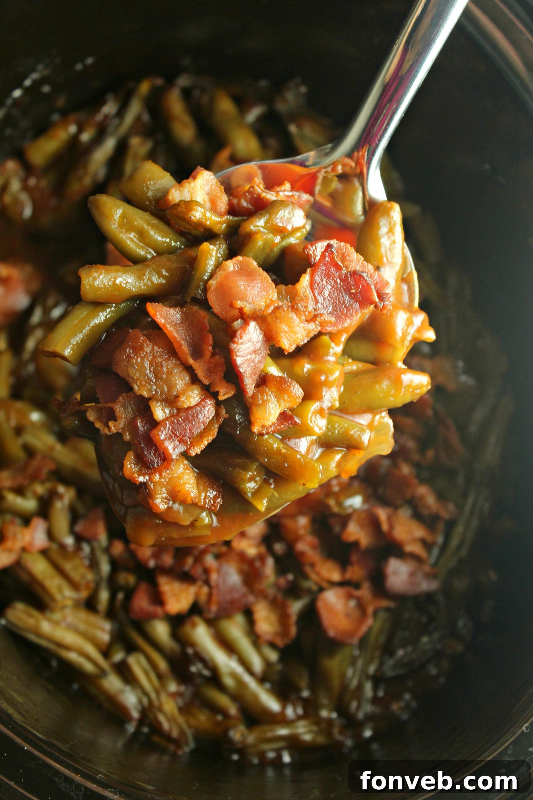 Hearty Slow Cooker Smothered BBQ Green Beans 4 Generous serving of BBQ green beans with bacon, showcasing the rich sauce and tender vegetables