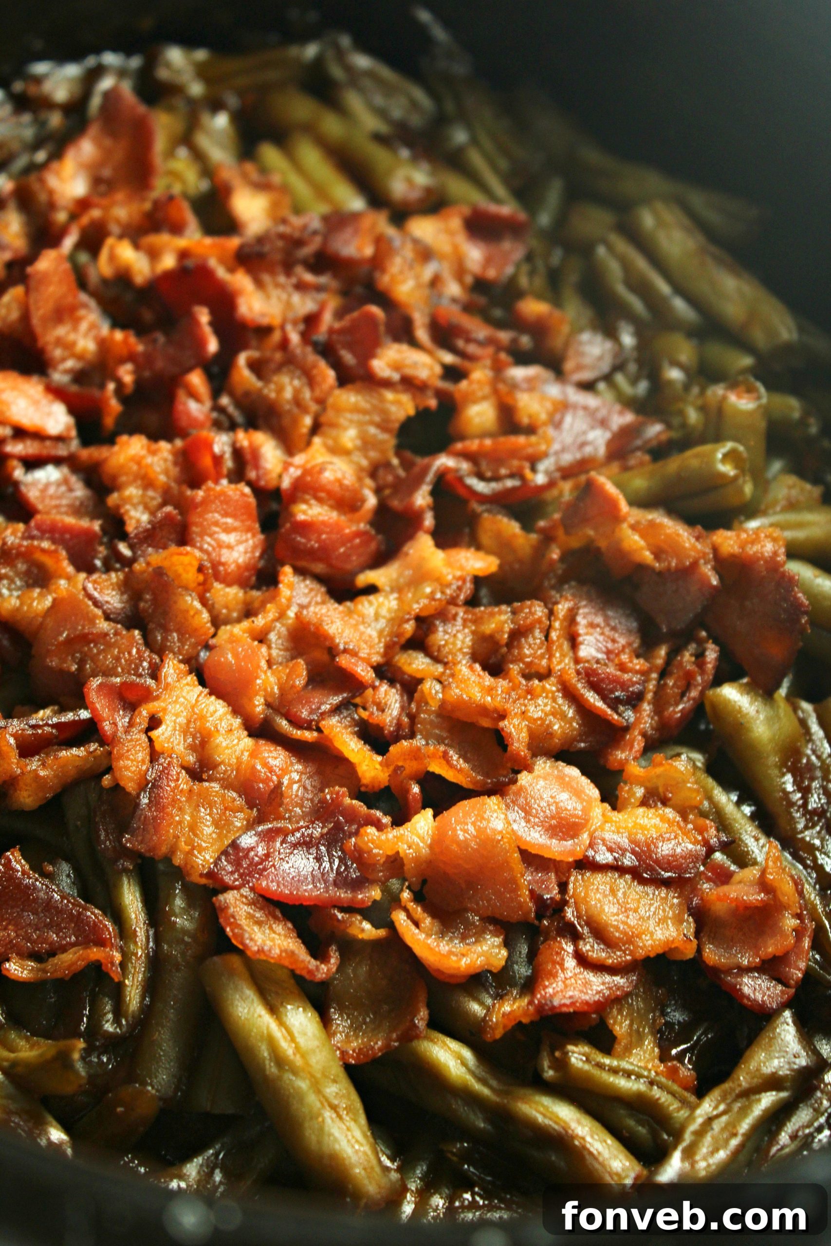 Hearty Slow Cooker Smothered BBQ Green Beans 7 Cooked Slow Cooker Smothered Barbecue Green Beans in the slow cooker, close-up