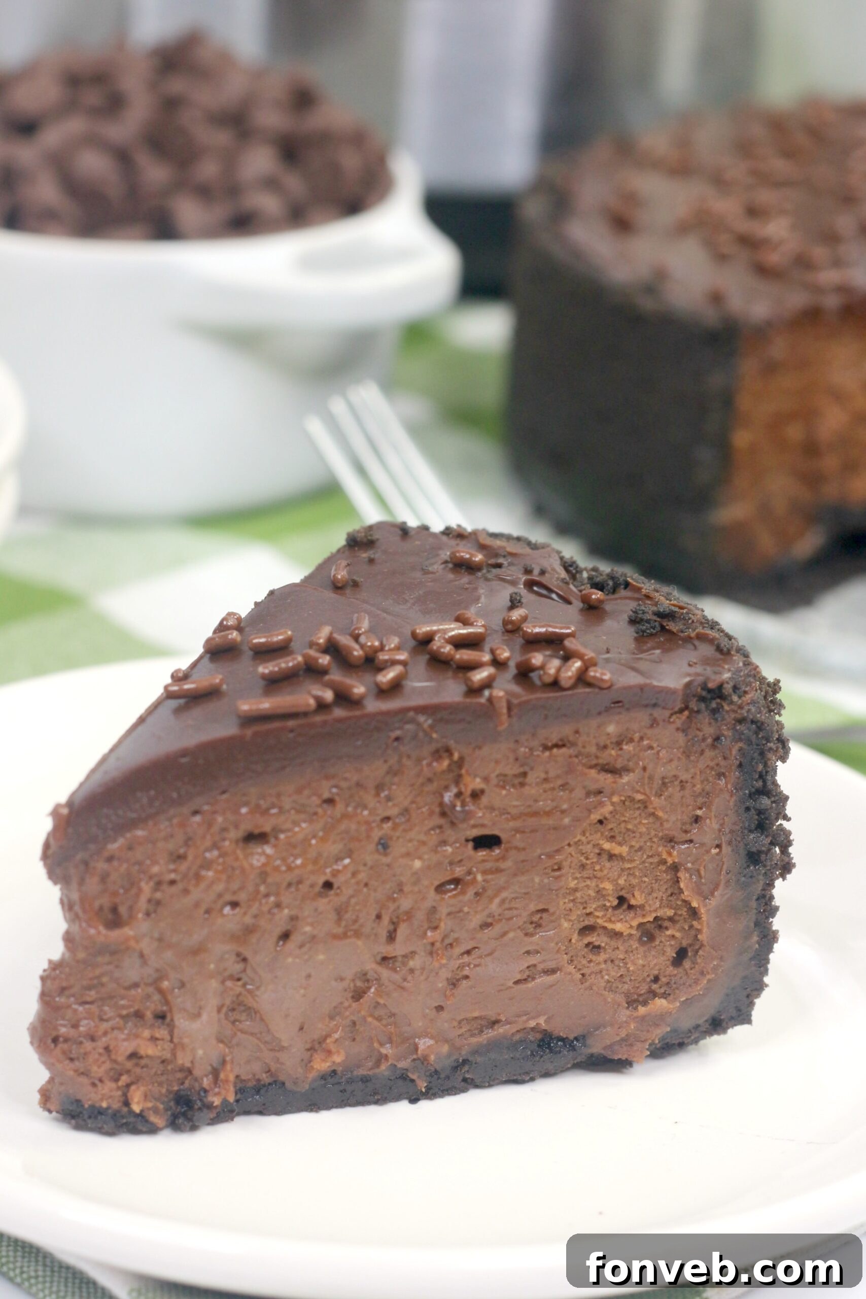 Finished Death by Chocolate Cheesecake with ganache and sprinkles