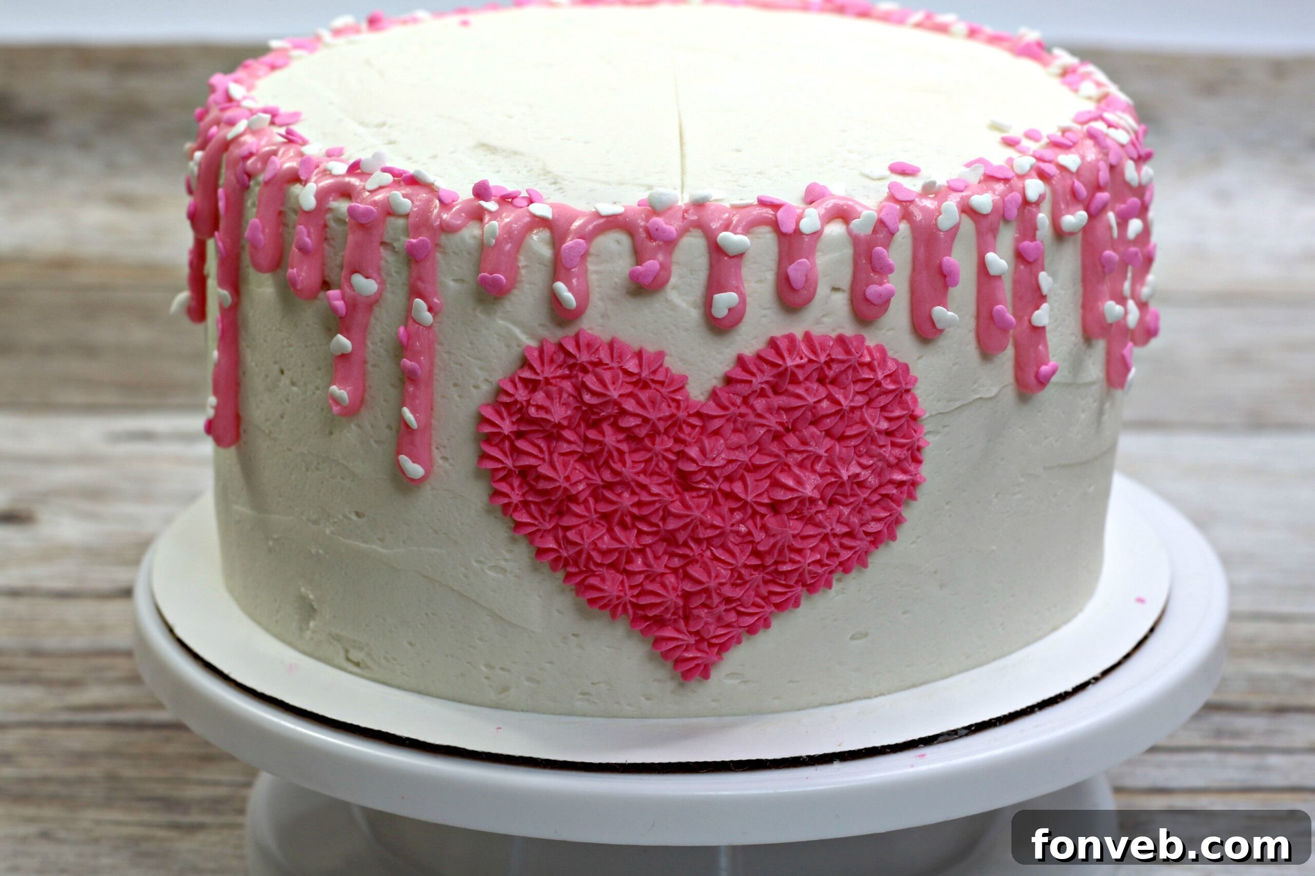 A beautifully frosted Valentine’s Day Love Cake with a perfectly piped heart design on the front.