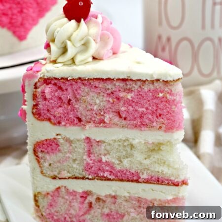 Valentine's Day Love Cake with pink frosting and sprinkles