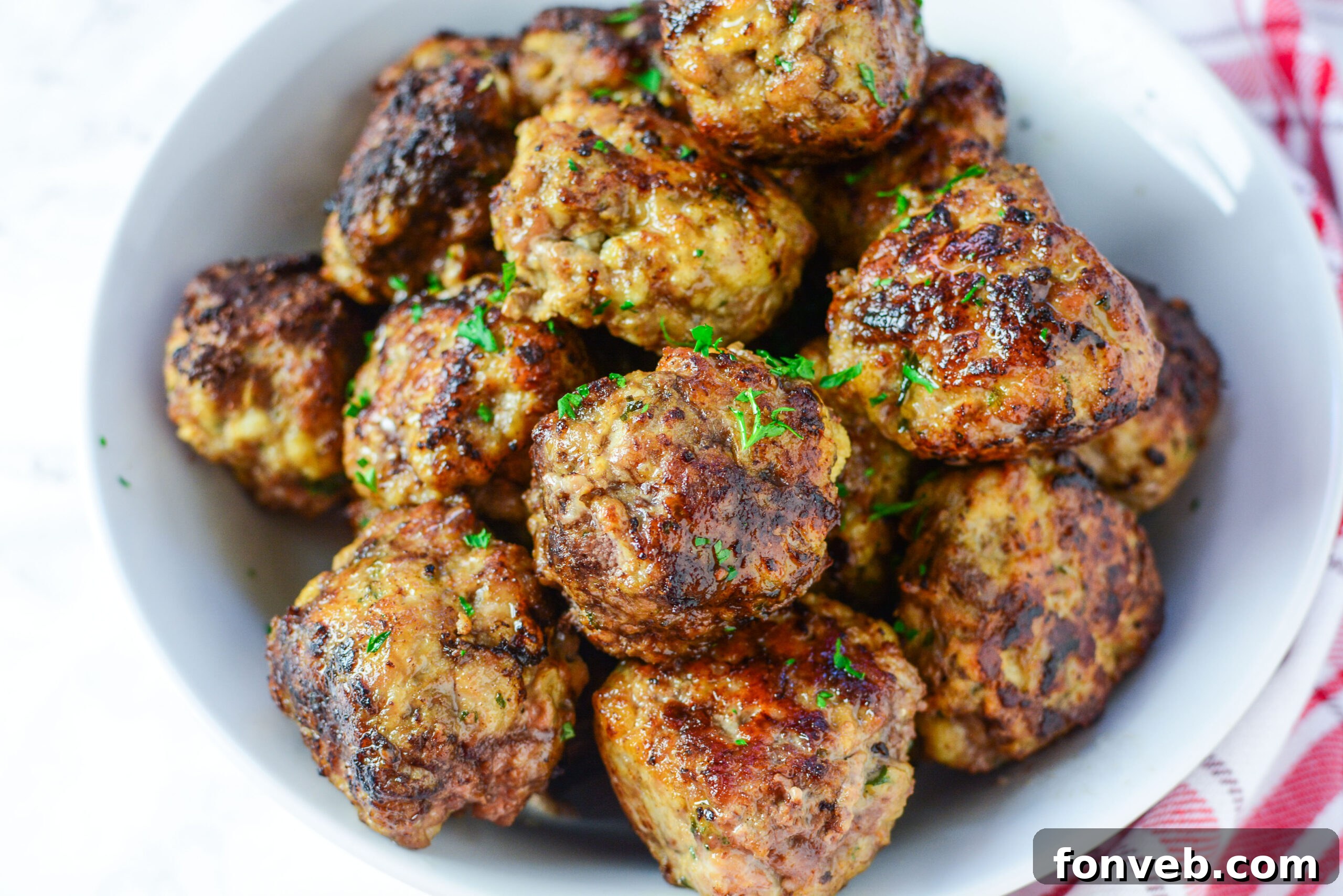 Various dishes featuring baked Italian meatballs, showcasing their versatility.