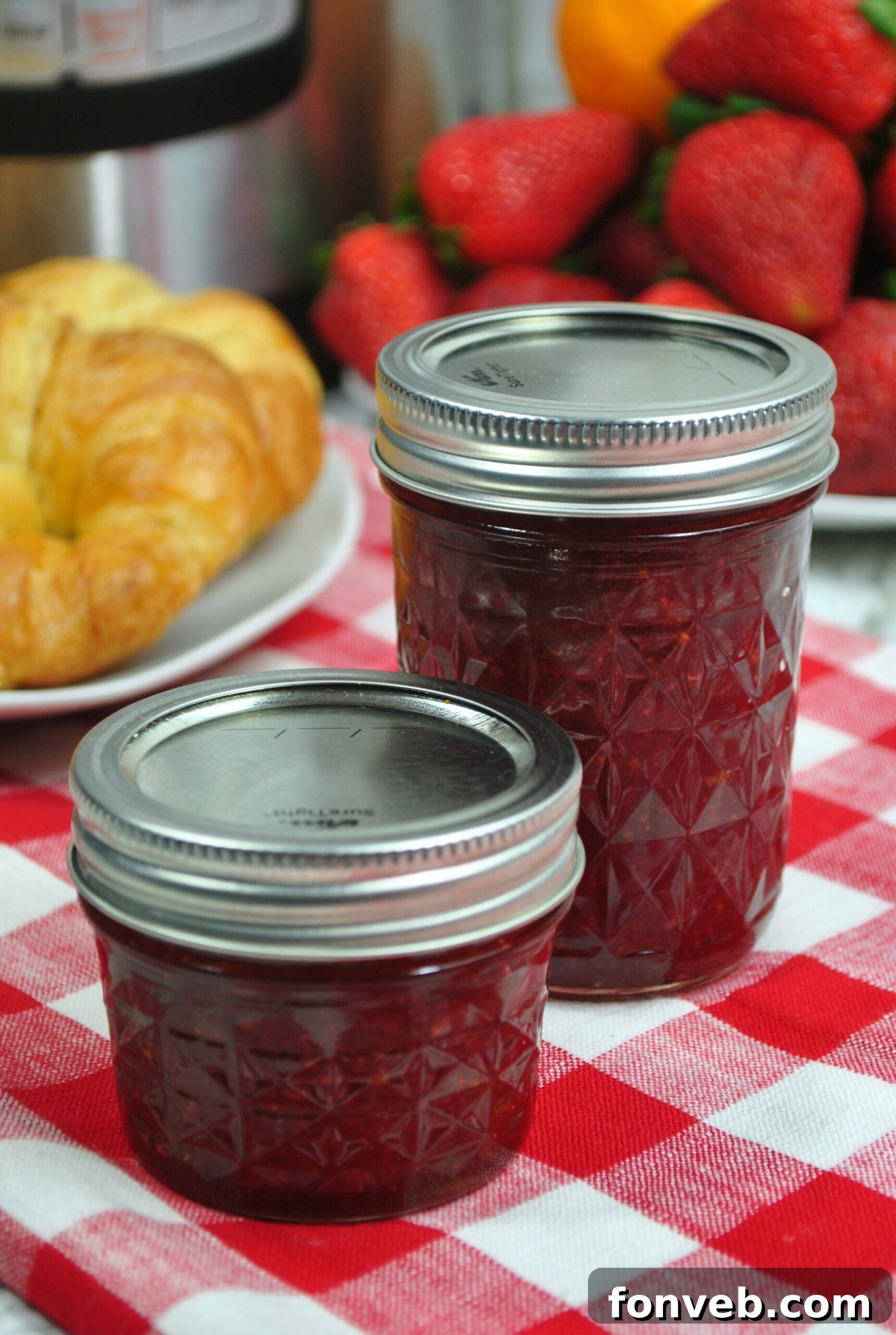 Close-up of freshly made strawberry jam in a mason jar