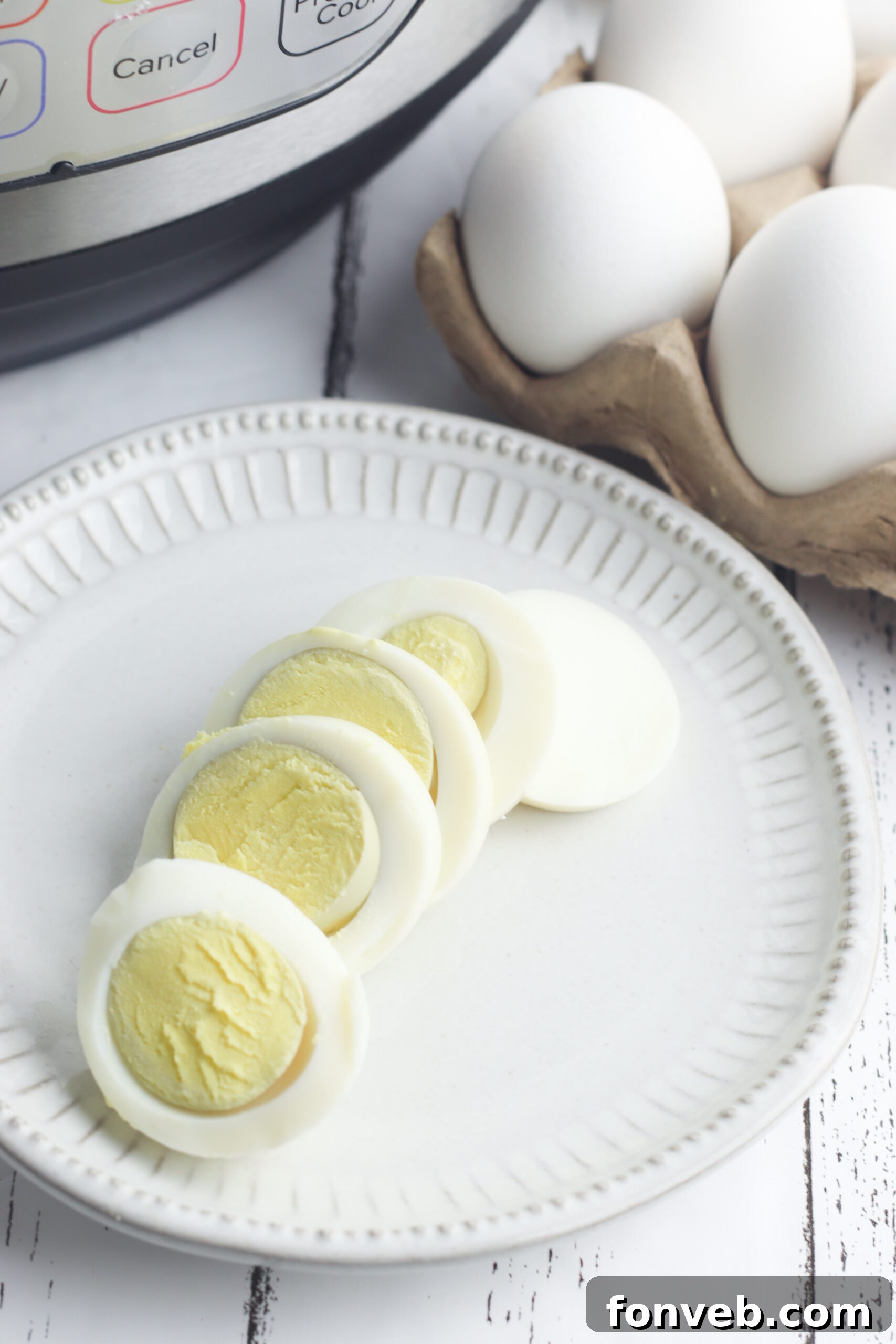 Foolproof Instant Pot Hard Boiled Eggs 7 Multiple peeled hard-boiled eggs in a bowl