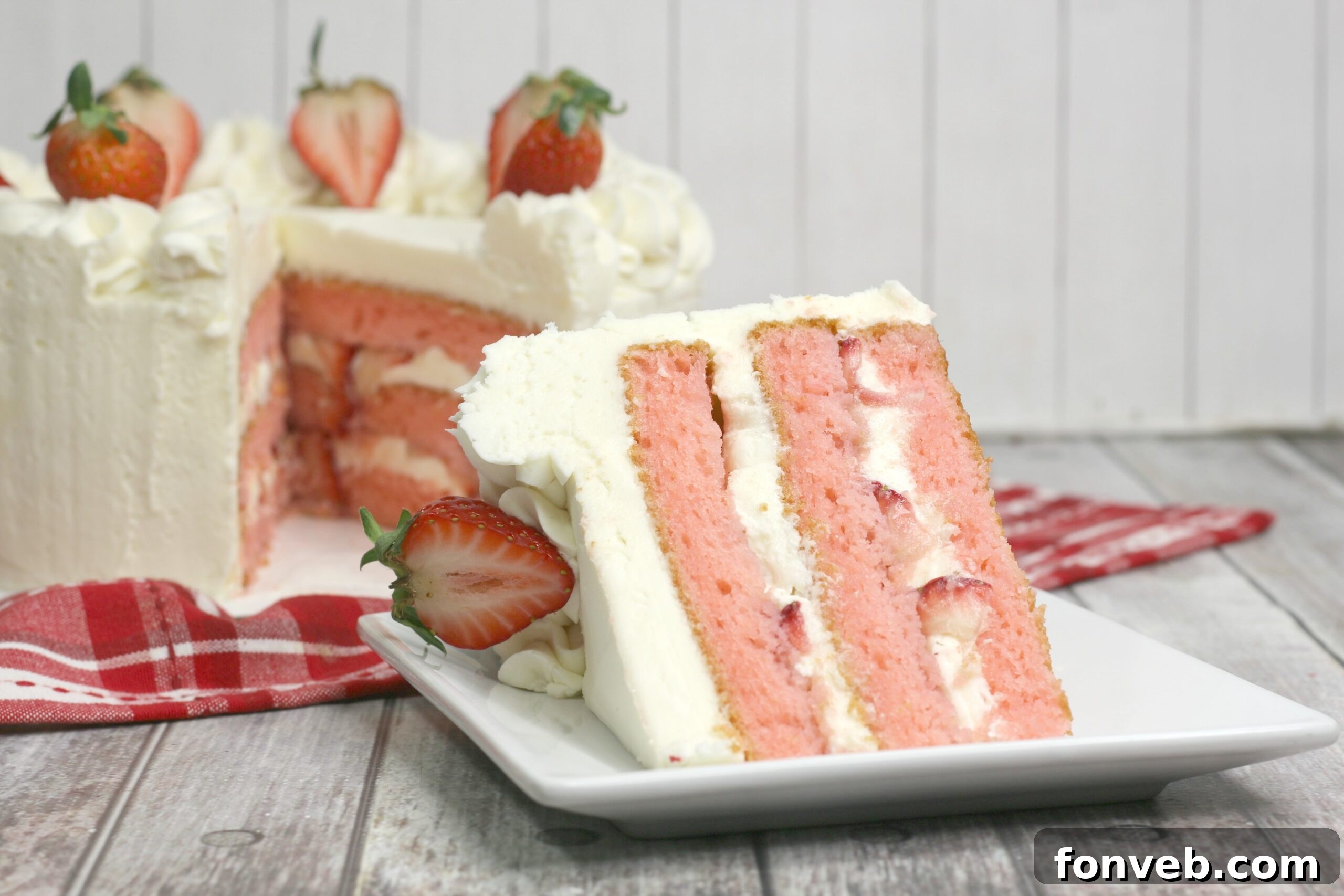 Moscato Infused Strawberry Cake with Cream Cheese Buttercream 7 A beautifully decorated Strawberry Moscato Cake with Cream Cheese Buttercream Frosting, ready to be served.