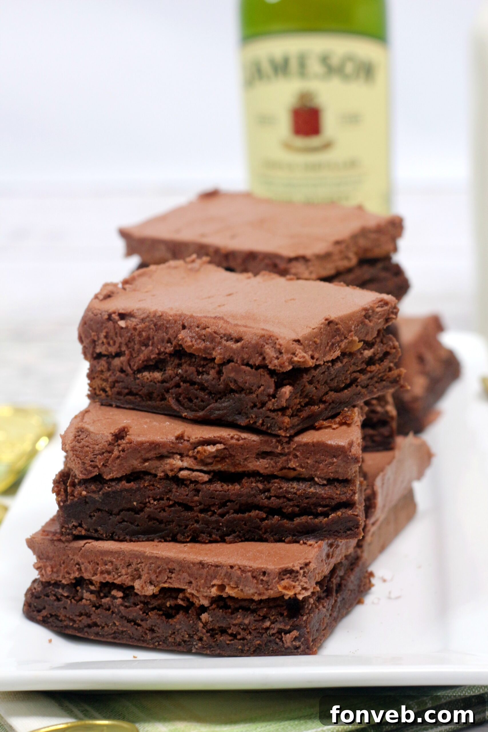 Individual Irish Fudge Brownie square with thick frosting, garnished for St. Patrick's Day
