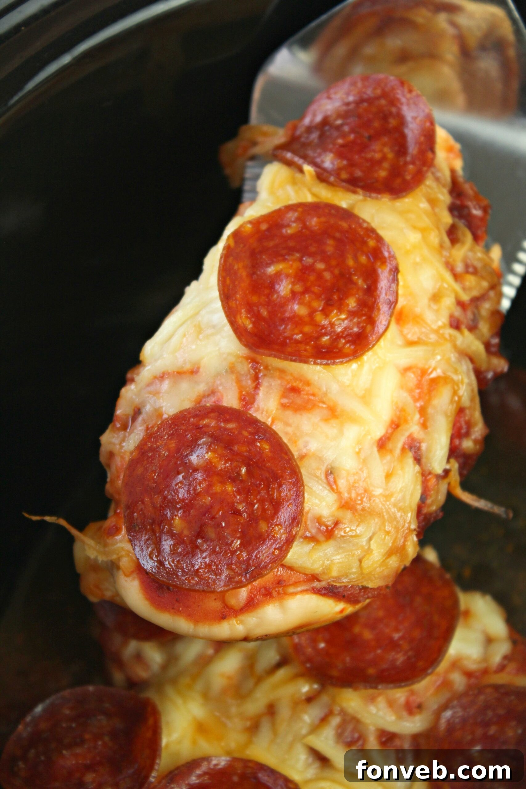 Close-up of Slow Cooker Pizza Chicken, showing melted cheese and pepperoni