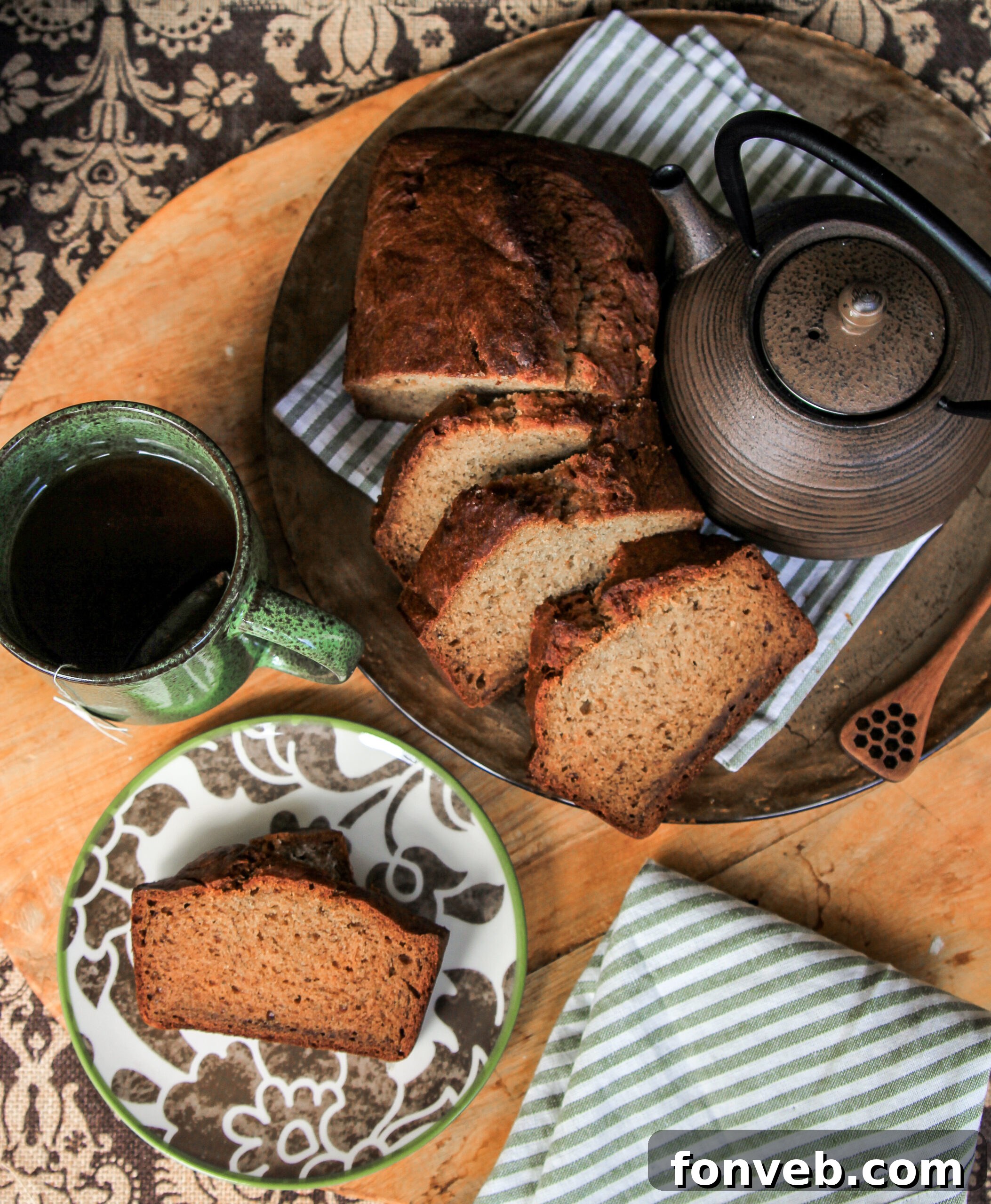 A trio of perfectly overripe bananas, essential for the best banana bread, on a rustic wooden surface