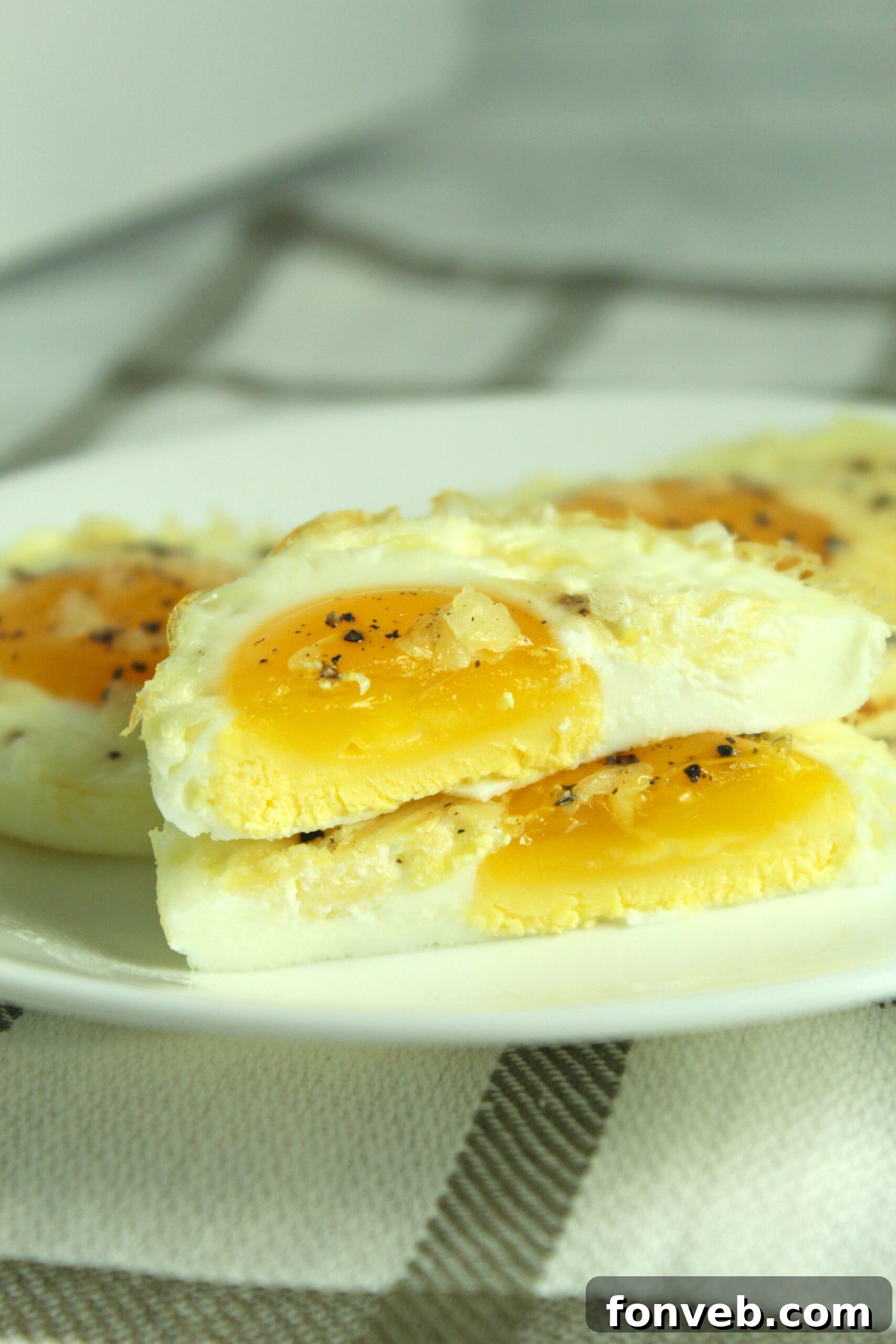 The Perfect Oven Fried Eggs 8 Close-up of baked fried eggs, seasoned and ready to eat