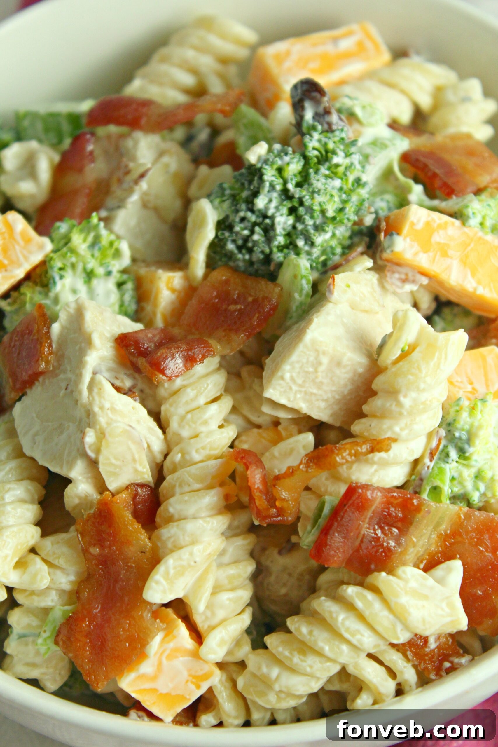Chicken Bacon Broccoli Pasta Salad in a glass bowl on a table
