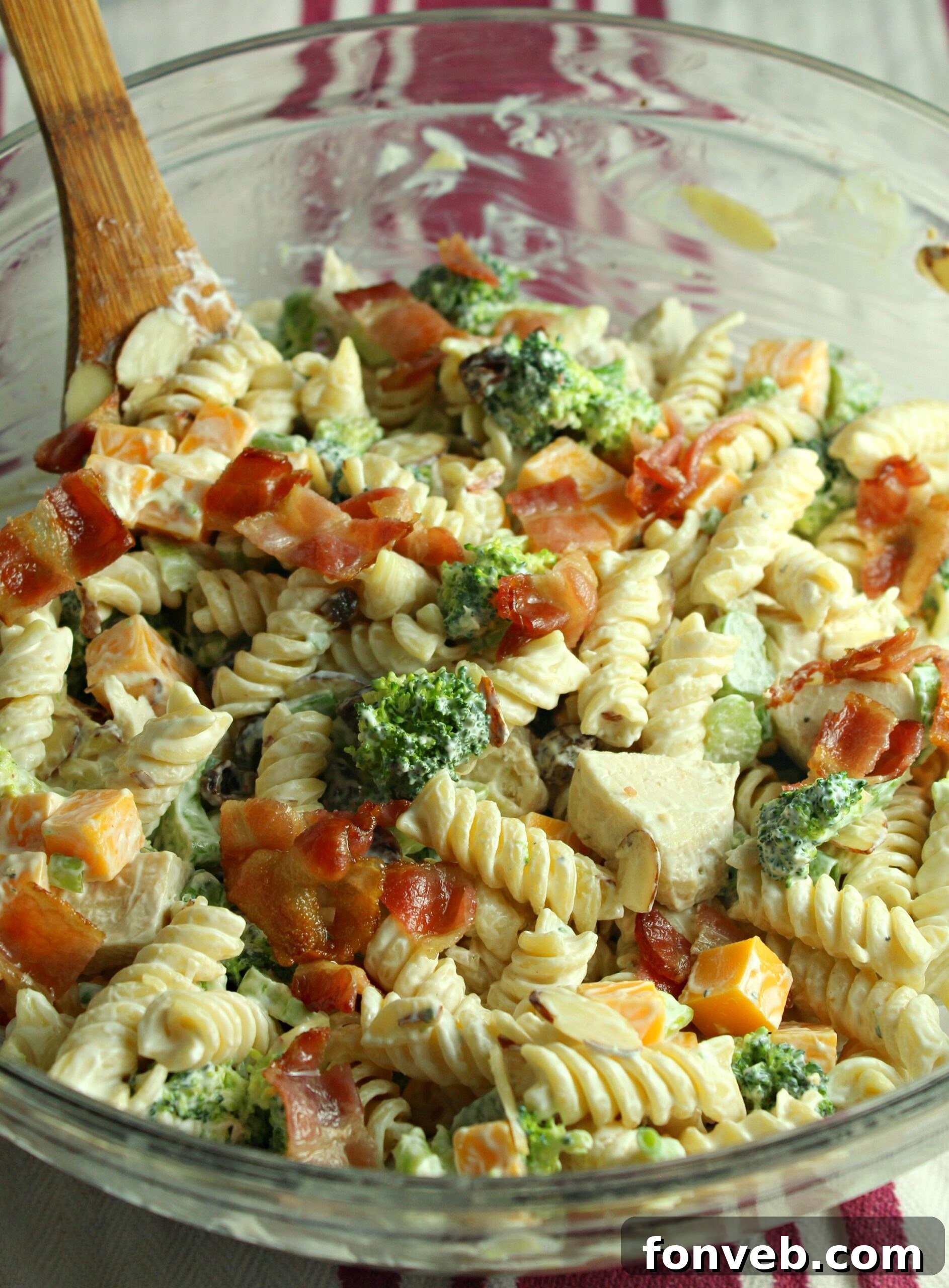 Chicken Bacon Broccoli Pasta Salad in a glass bowl, garnished