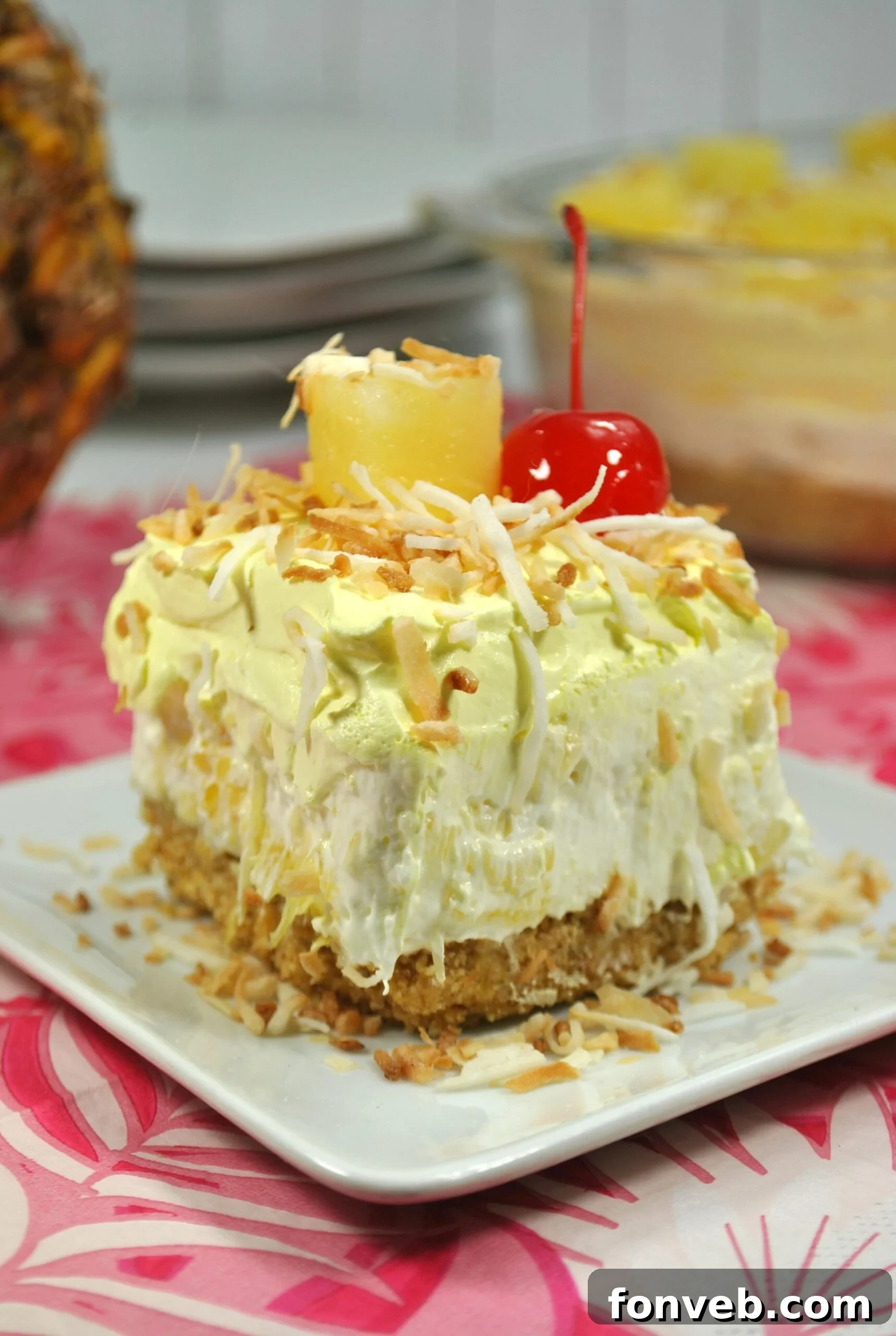 Individual serving of No-Bake Pineapple Dream Dessert with garnishes