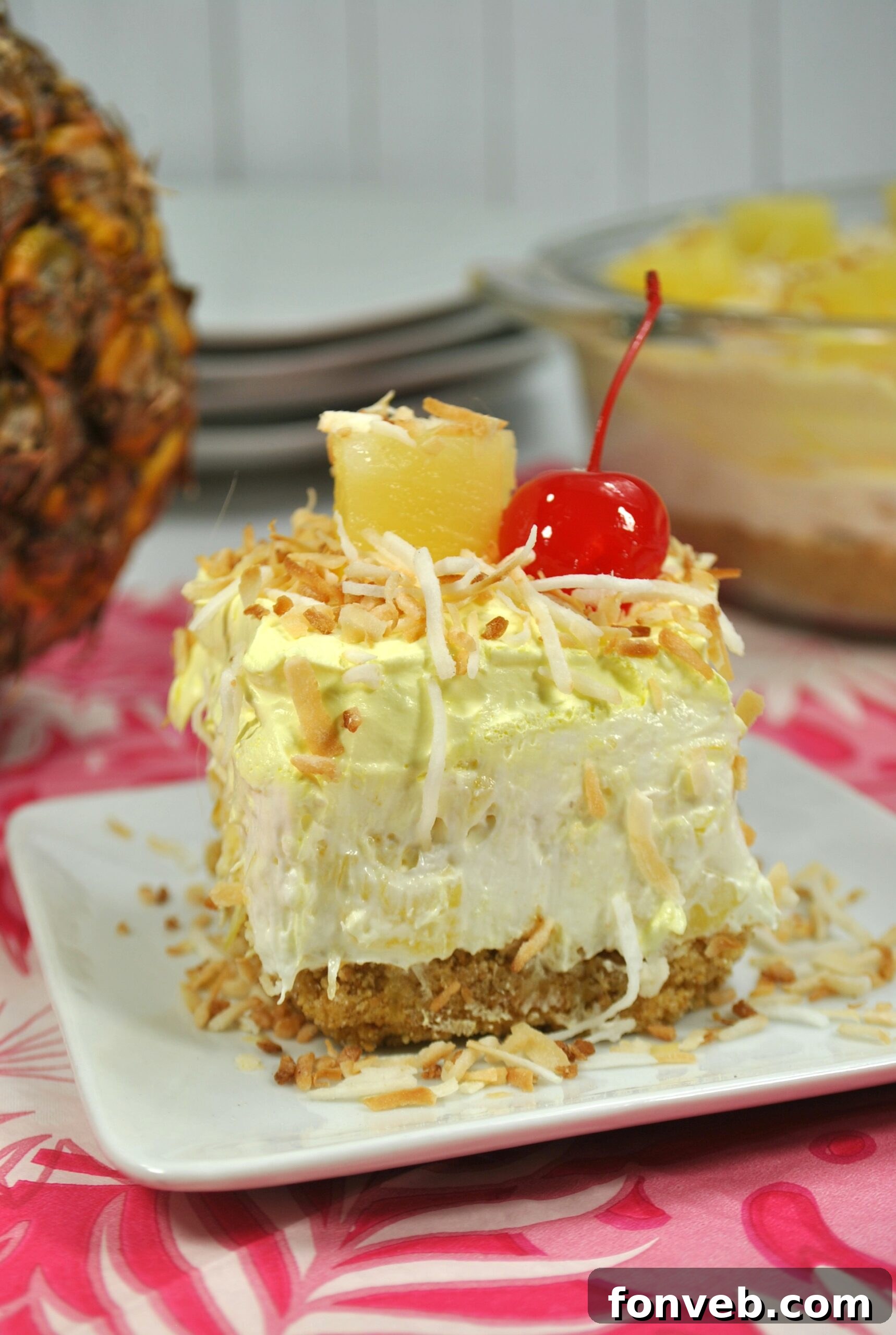 Overhead view of No-Bake Pineapple Dream Dessert topped with coconut and pineapple