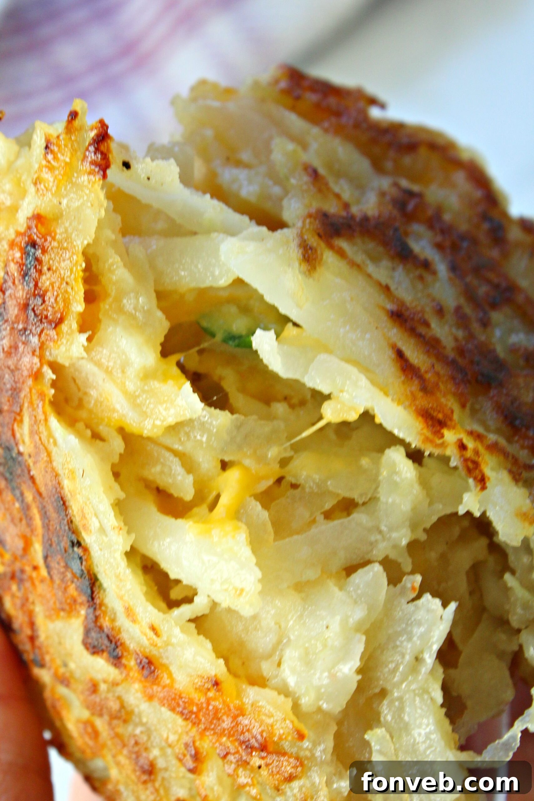 Several hash brown patties arranged on a platter, highlighting their perfect crispiness.