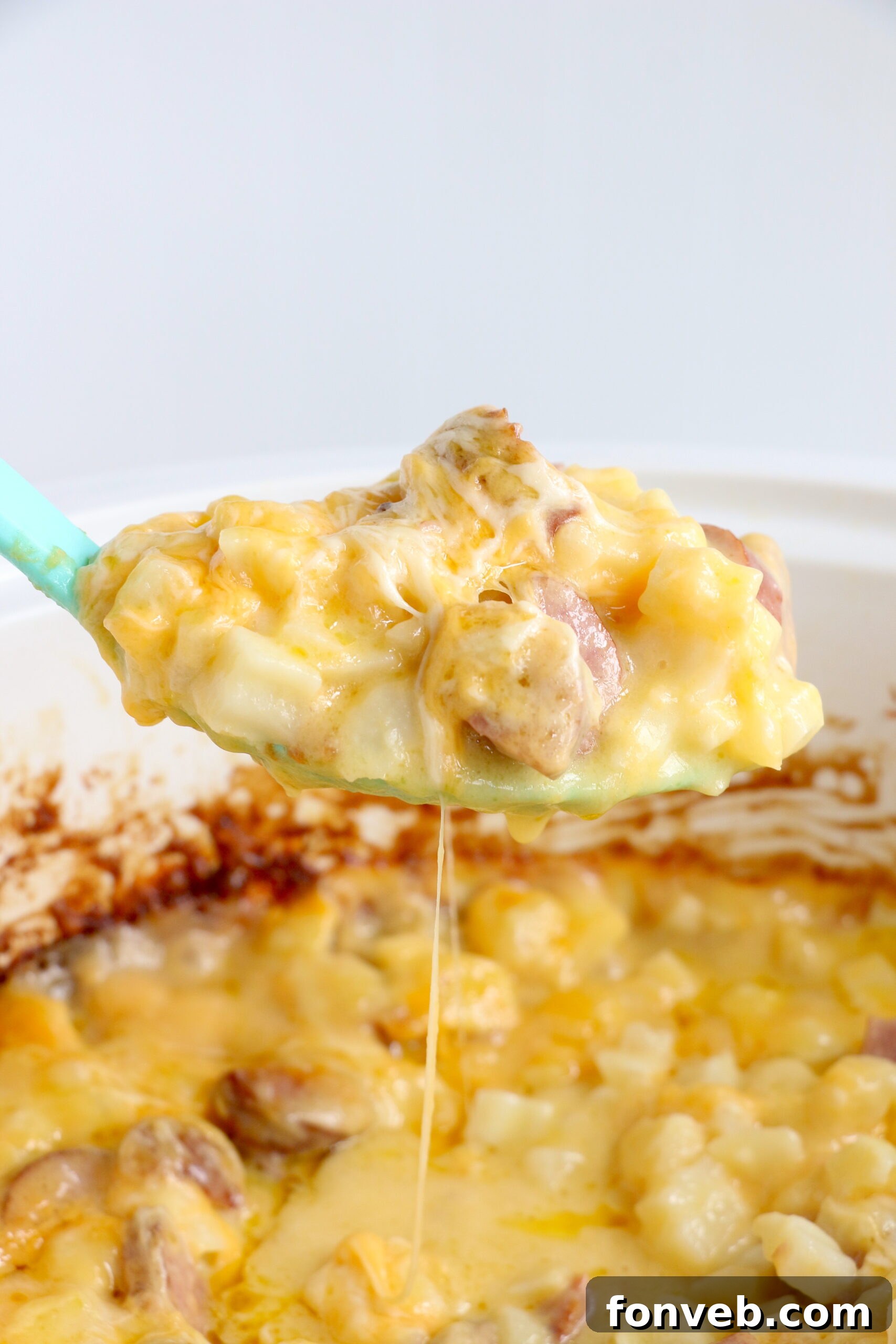 Close-up on the perfectly browned and cheesy top of the Slow Cooker Cheesy Kielbasa Hashbrown Casserole.
