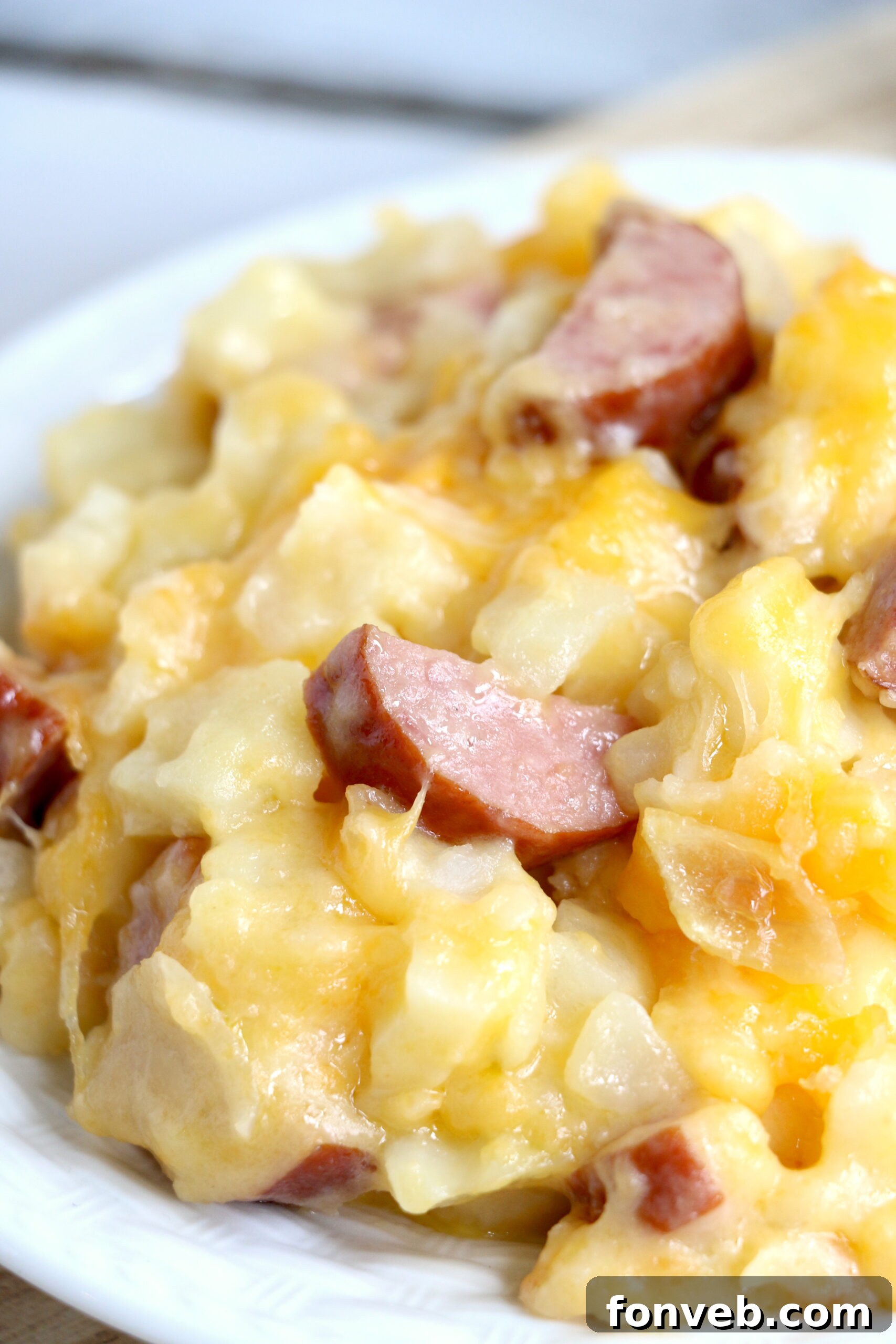 A close-up shot of the cooked casserole, highlighting the golden-brown cheese and tender hashbrowns.