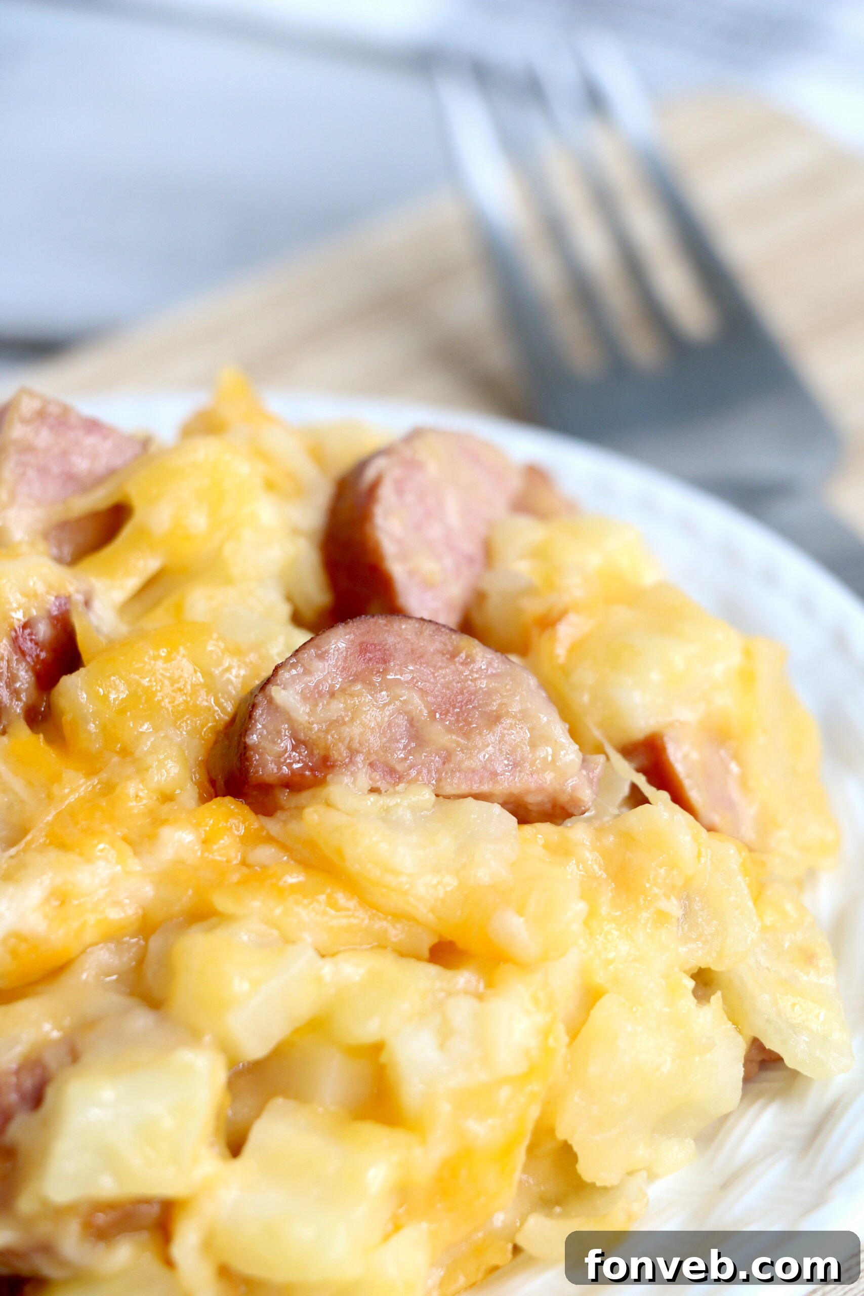 Another appealing close-up of the Slow Cooker Cheesy Kielbasa Hashbrown Casserole, garnished for serving.