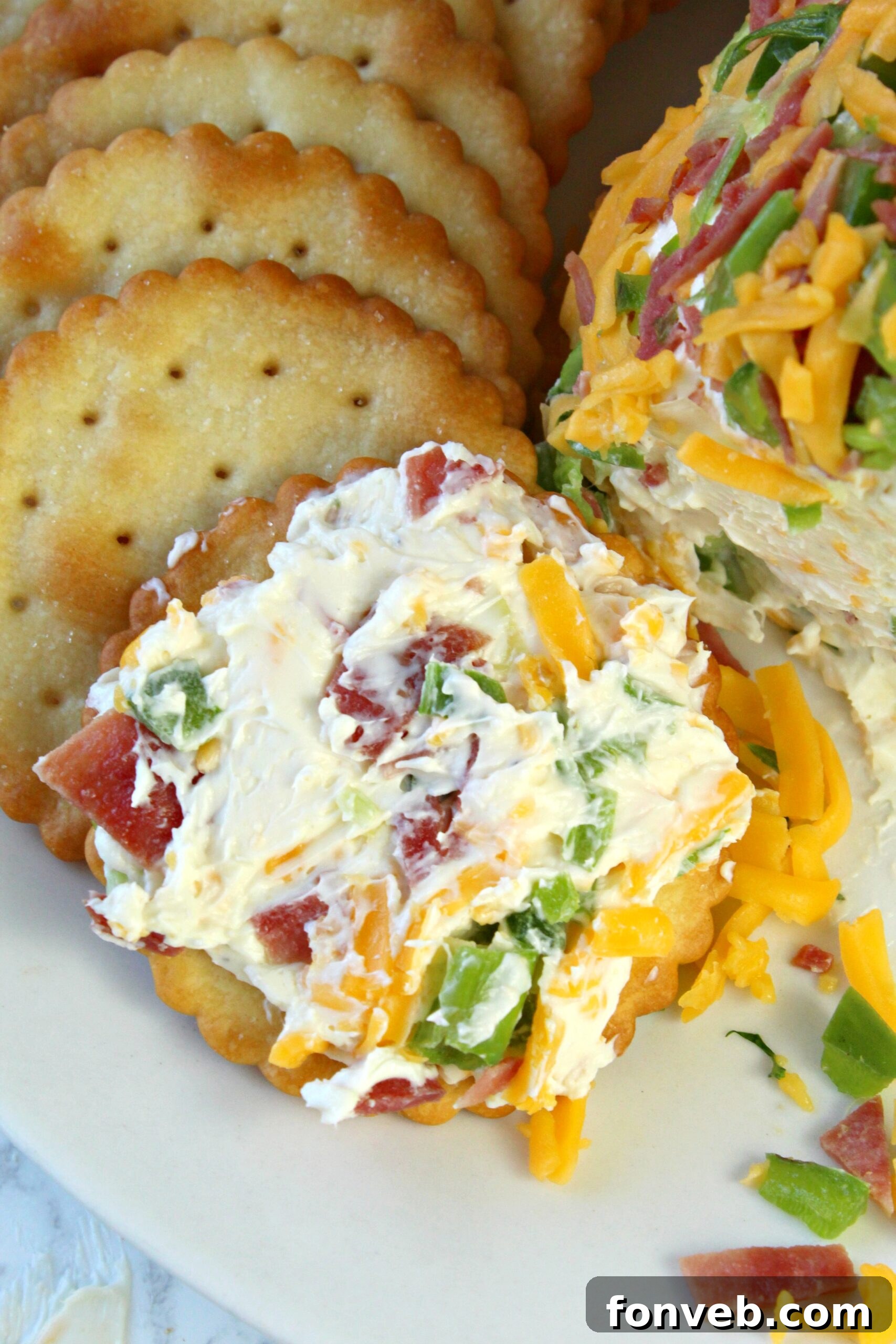 Spicy Cream Cheese Party Ball 3 Jalapeno Popper Cheese Ball served on a platter with crackers, showing its inviting texture