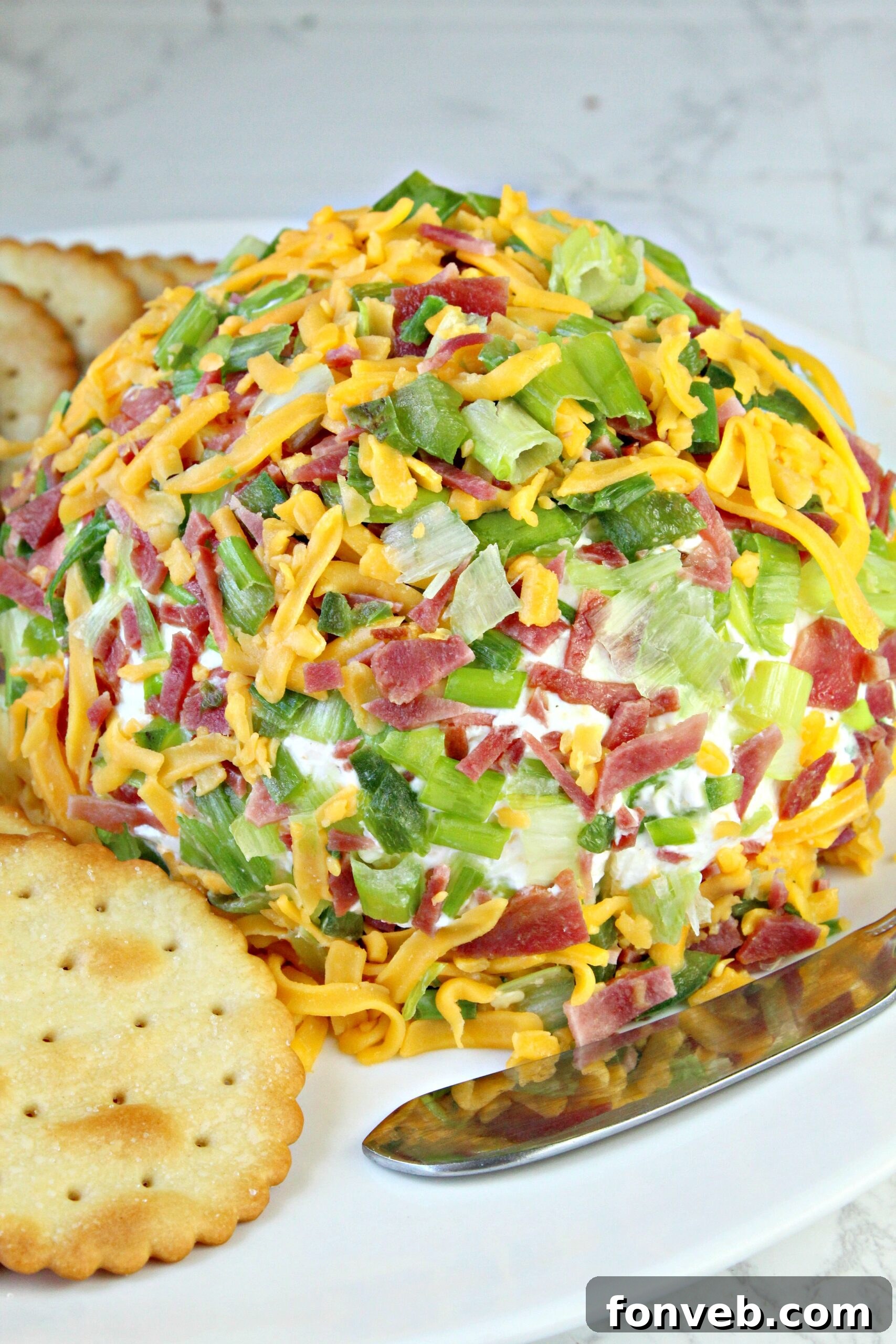 Spicy Cream Cheese Party Ball 6 Freshly prepared Jalapeno Popper Cheese Ball mixture being formed on plastic wrap