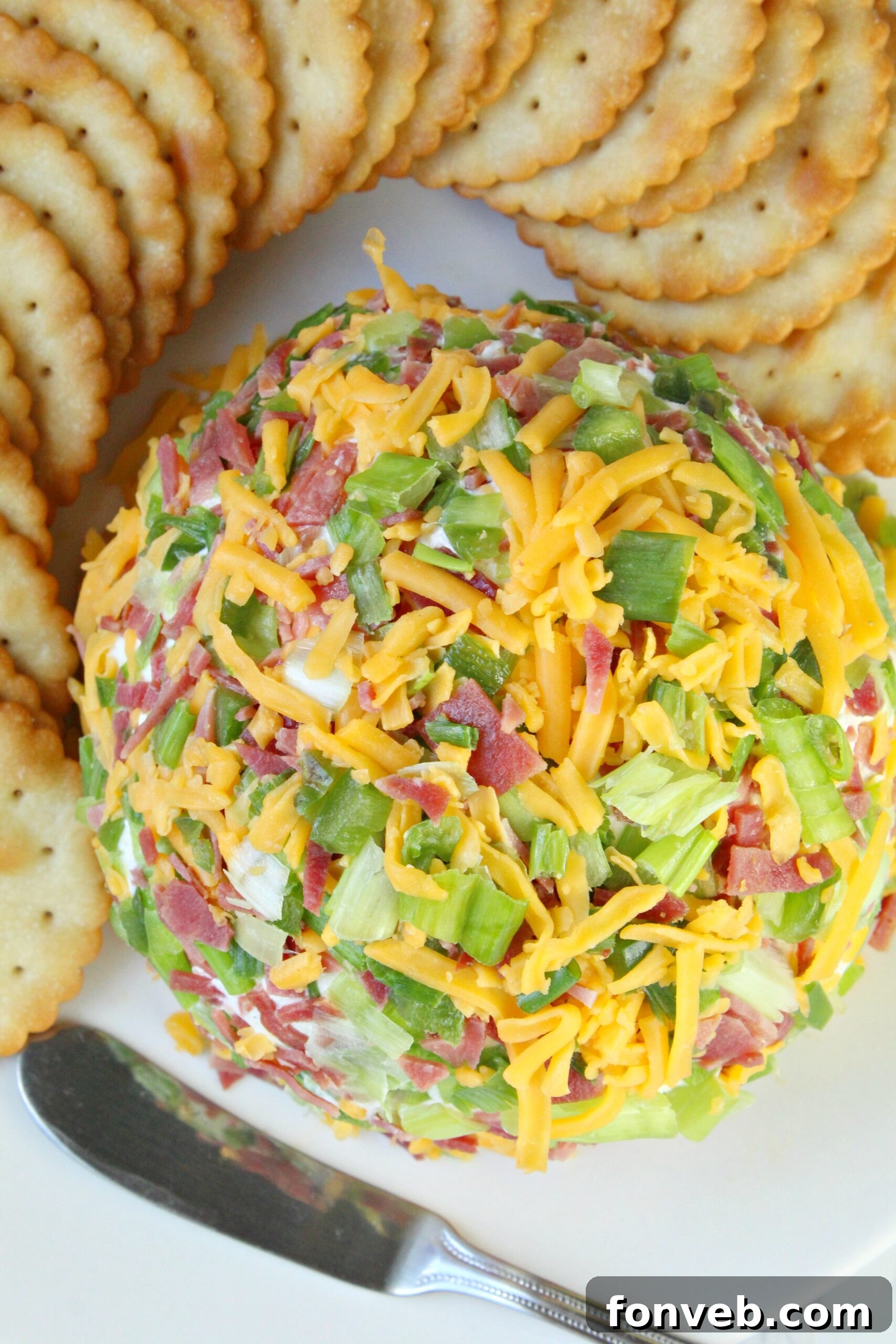 Spicy Cream Cheese Party Ball 8 A vibrant platter featuring the Jalapeno Popper Cheese Ball surrounded by various dippers