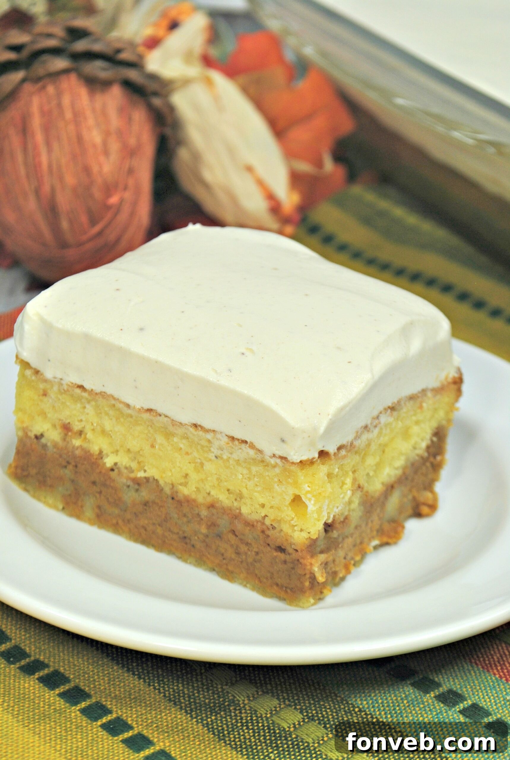 Enchanted Pumpkin Dream Cake 3 A close-up of the Pumpkin Magic Cake, showcasing its distinct layers of cake, pumpkin filling, and thick frosting.