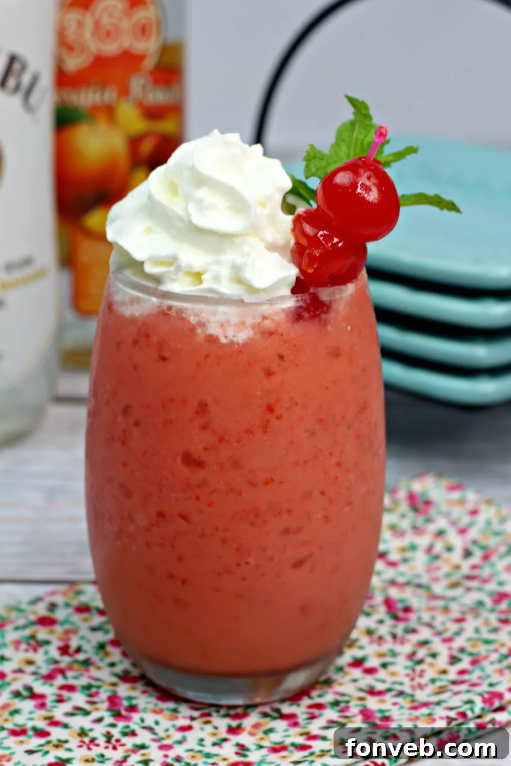 Secret Blush 4 A festive Pink Panties Cocktail garnished with a fresh strawberry and whipped cream