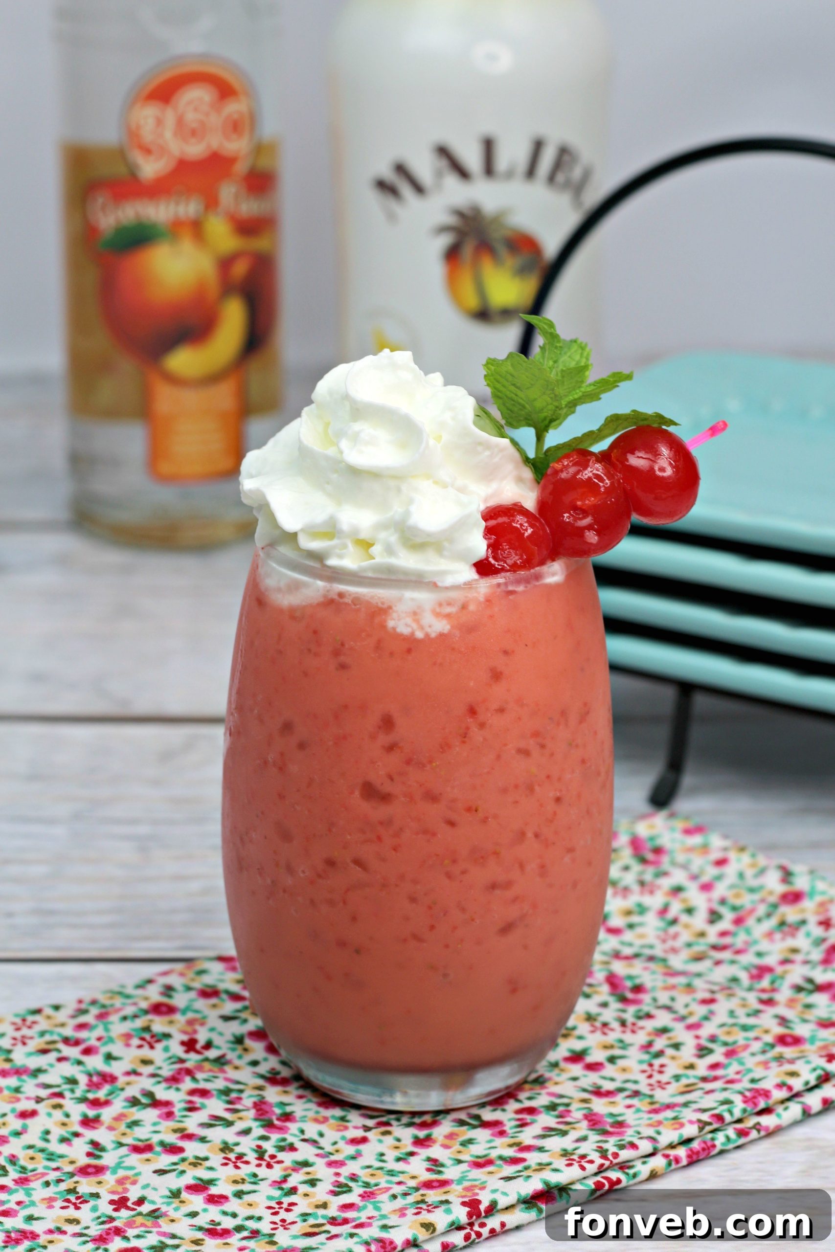 Secret Blush 5 Two glasses of Pink Panties Cocktails on a wooden surface, highlighting their frothy texture