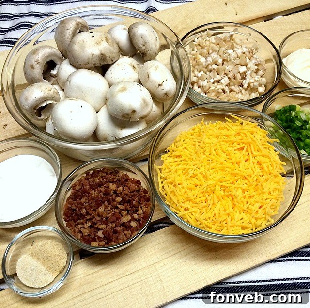 A close-up view of perfectly stuffed mushrooms, showcasing the rich, golden-brown filling and crispy bacon bits.