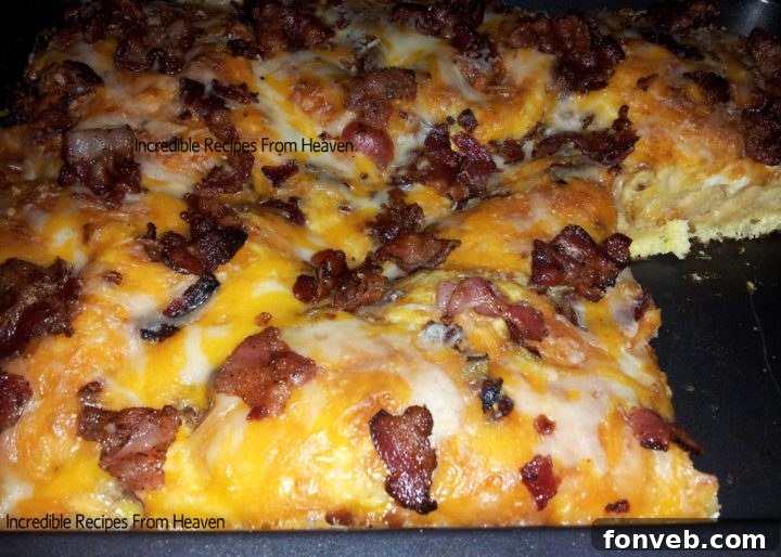 A closer look at the delicious, golden-brown top of the Bacon, Egg, and Cheese Biscuit Bake, highlighting the melted cheese and crispy bacon.