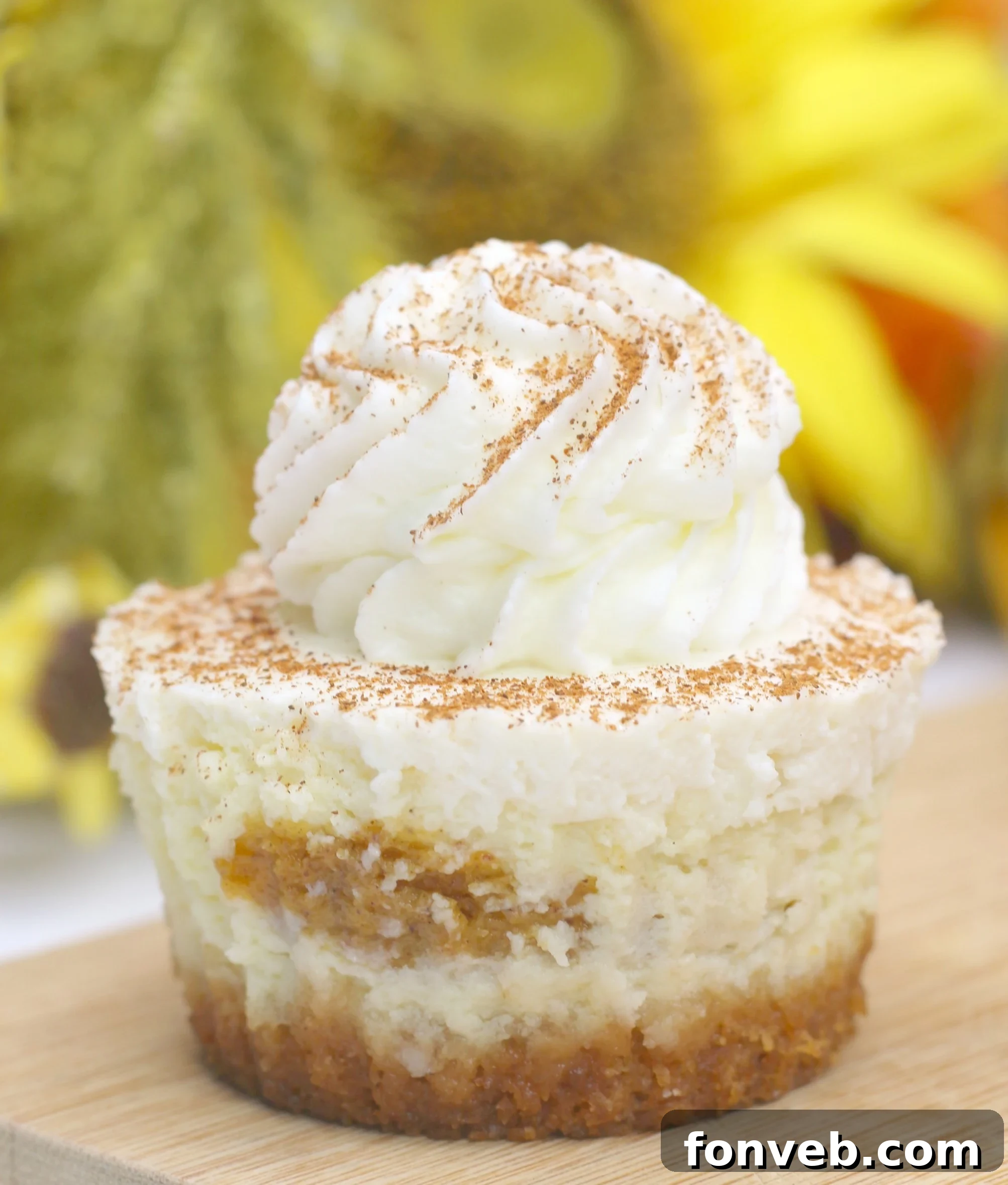 Delicious Pumpkin Swirl Cheesecakes ready for serving, showcasing the vibrant orange pumpkin swirl against the creamy cheesecake base