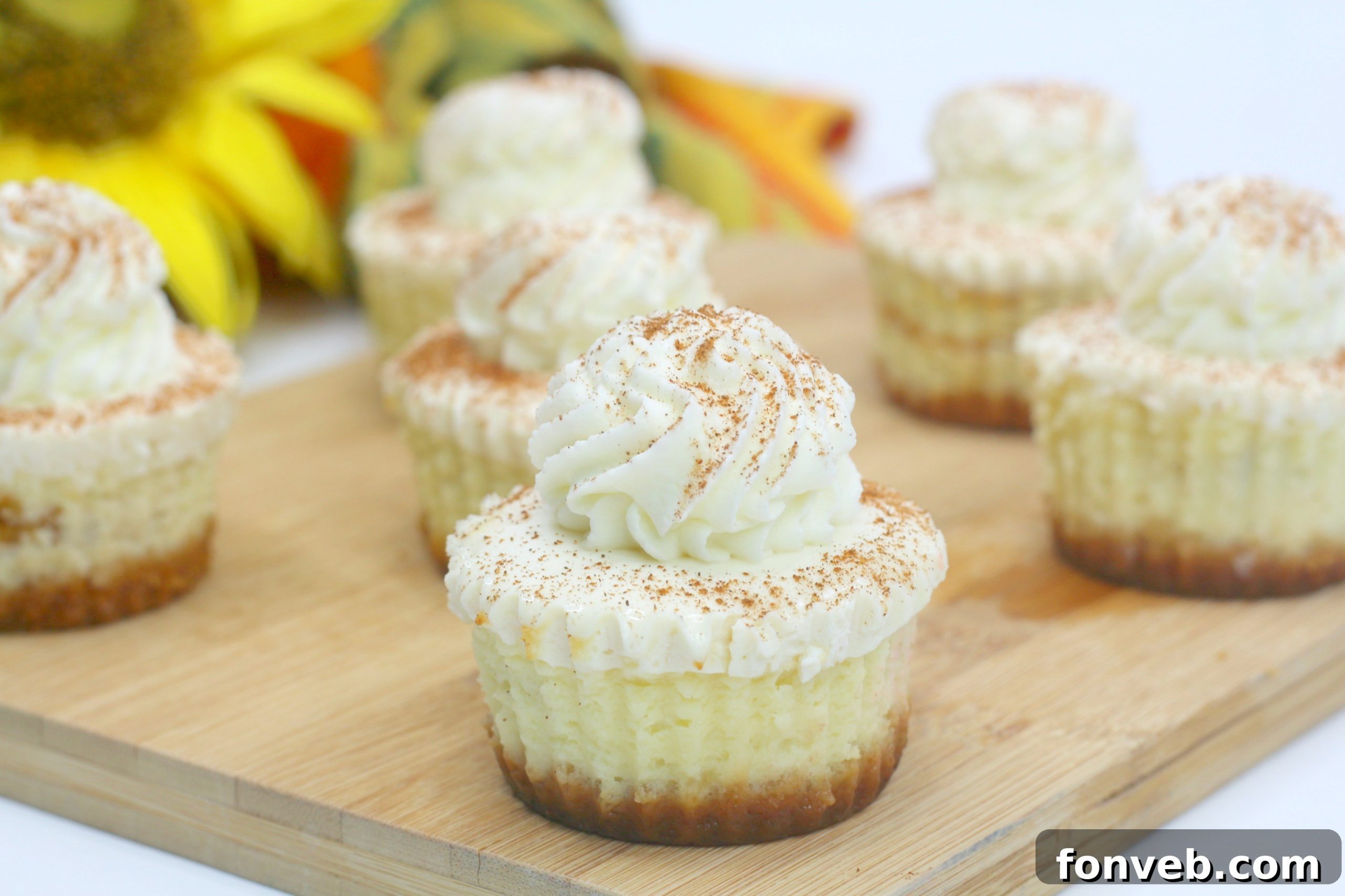 A beautifully composed shot of multiple Pumpkin Swirl Cheesecakes on a serving platter, inviting guests to enjoy