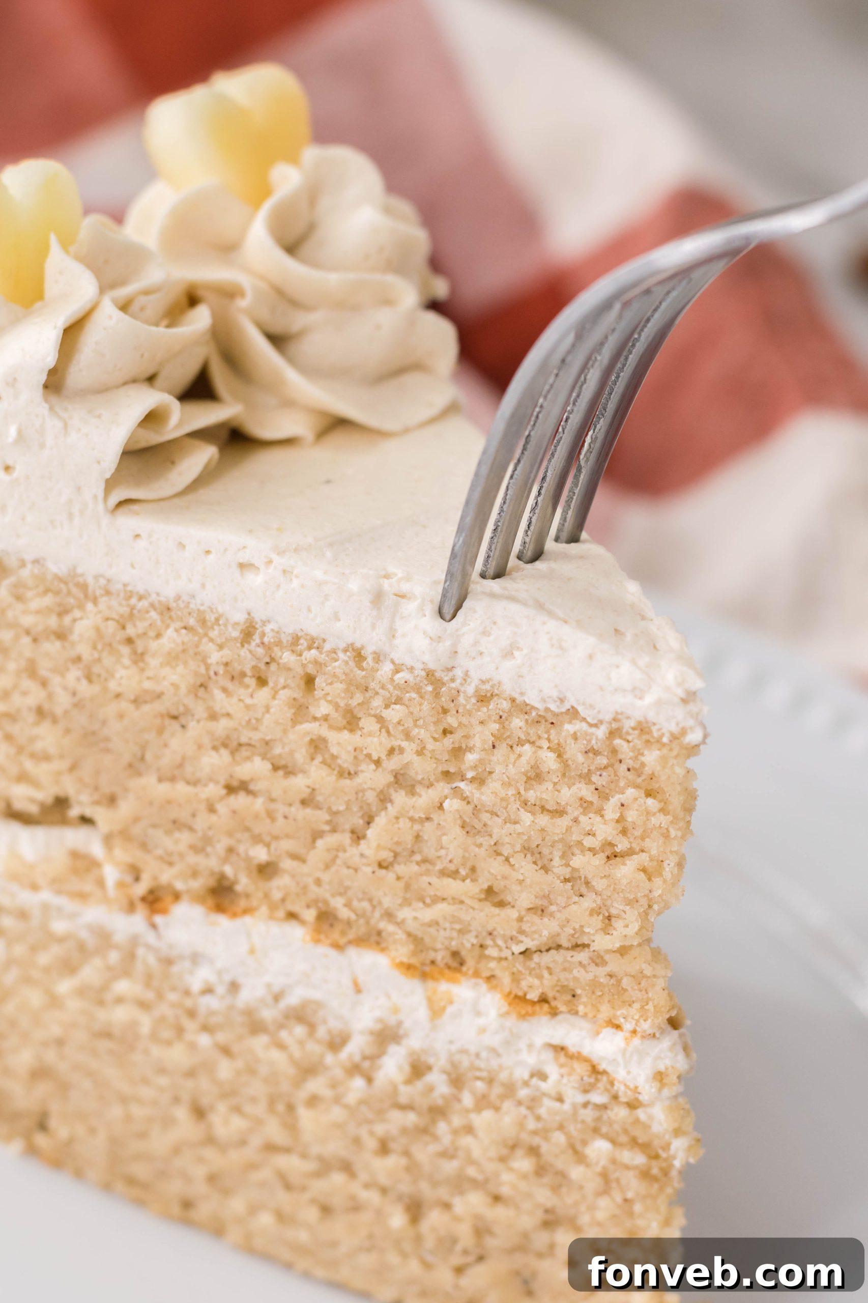 Spiced Apple Cider Cake with Caramel Frosting 6 Close-up of the Apple Cider Cake, showing the texture and frosting swirl.