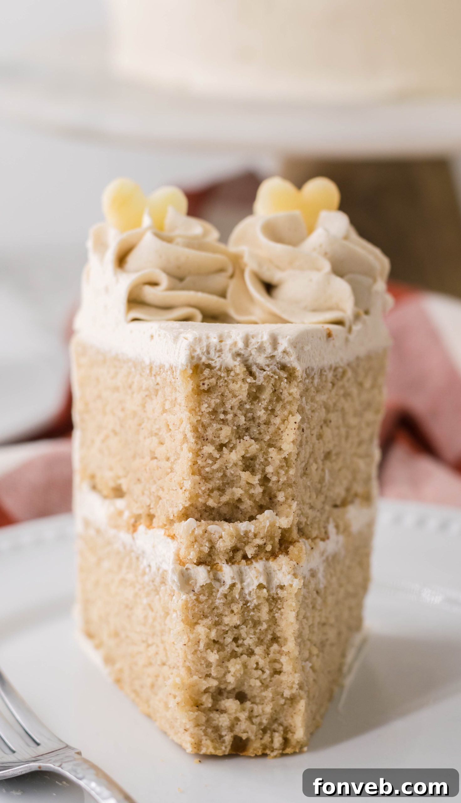 Spiced Apple Cider Cake with Caramel Frosting 7 Overhead shot of Apple Cider Cake, garnished with fresh apples and cinnamon sticks.