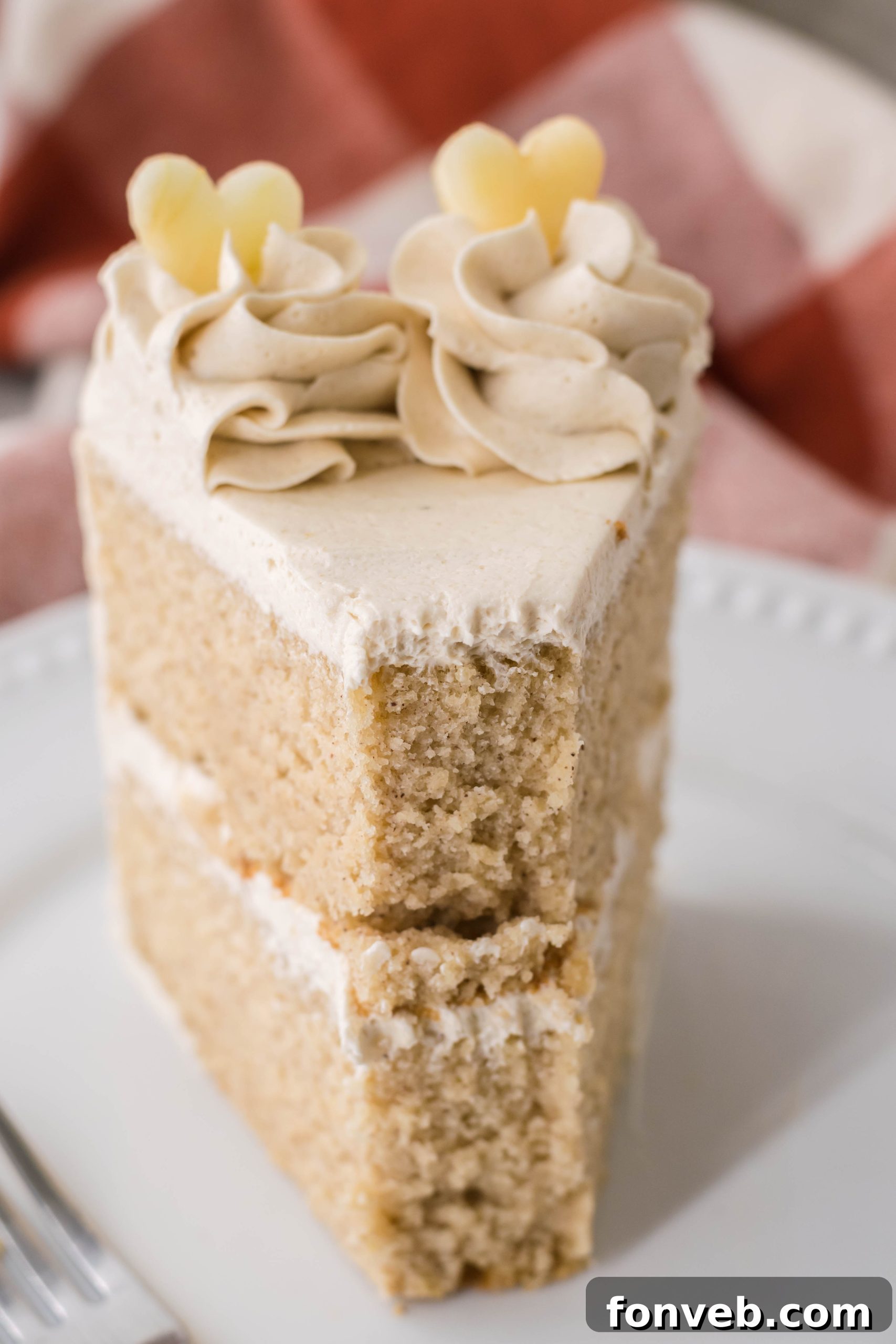 Close-up of cake crumbs and frosting texture on Apple Cider Cake.