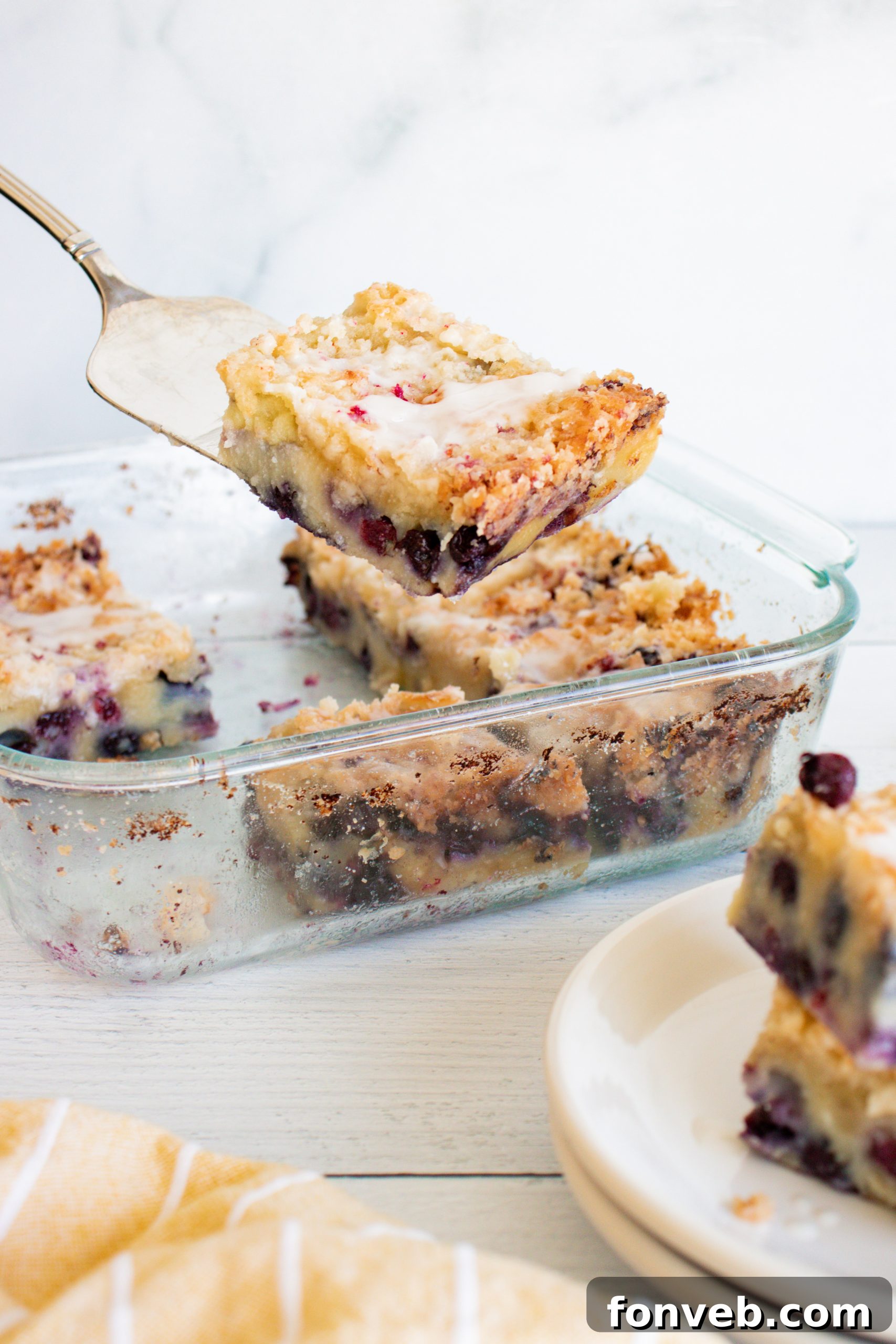 Blueberry Muffin Crumble Cake with Vanilla Drizzle 8 Beautifully drizzled vanilla glaze over the blueberry muffin cake.