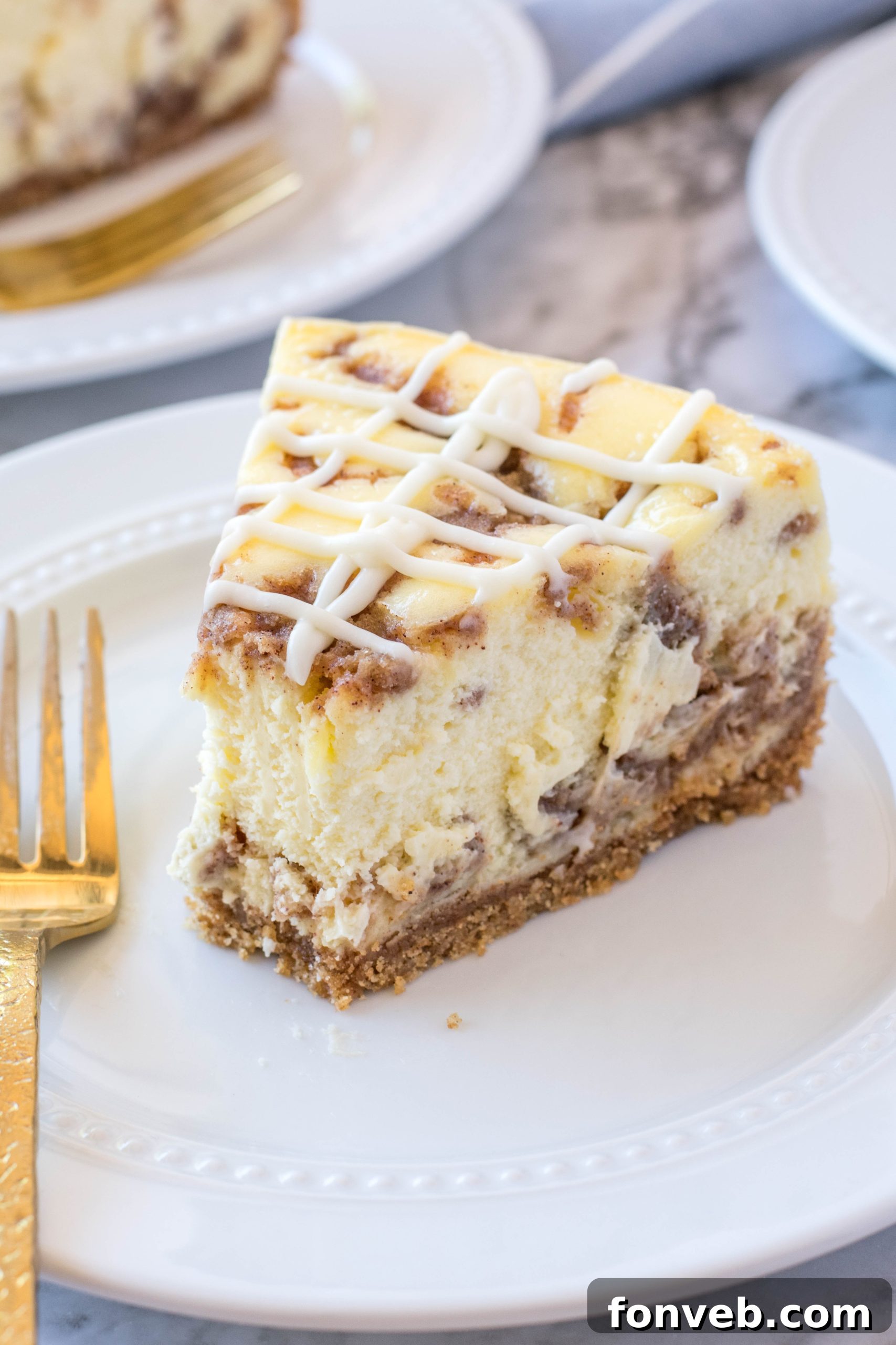 An inviting display of multiple slices of Cinnamon Roll Cheesecake, artfully arranged on a serving board.