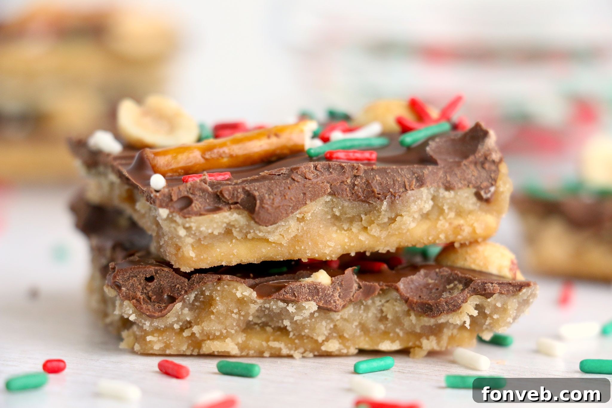 Toffee Pretzel Peanut Bark 6 Various pieces of Pretzel Peanut Cracker Toffee on a platter, showcasing different topping arrangements.