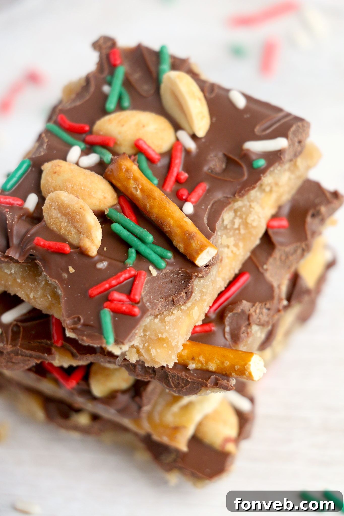 Toffee Pretzel Peanut Bark 7 Close-up of a broken piece of Pretzel Peanut Cracker Toffee, highlighting the delicious layers.