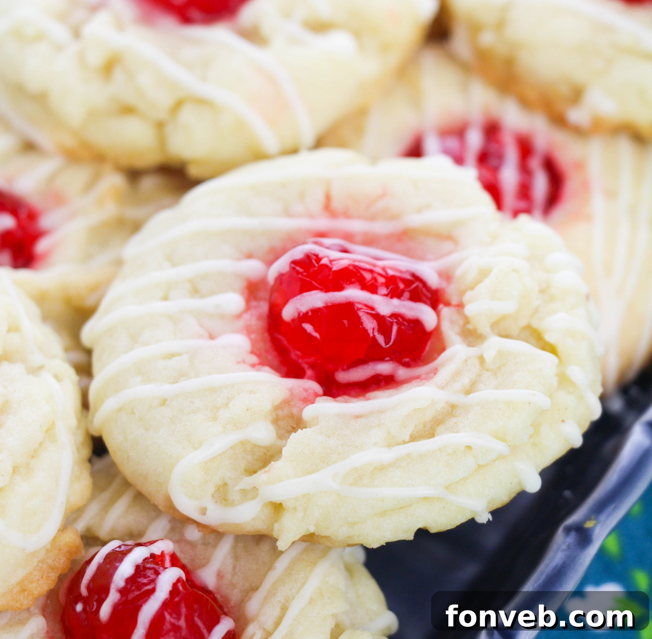 Another close-up shot of Eggnog Thumbprint Cookies on a baking sheet, highlighting their unique shape