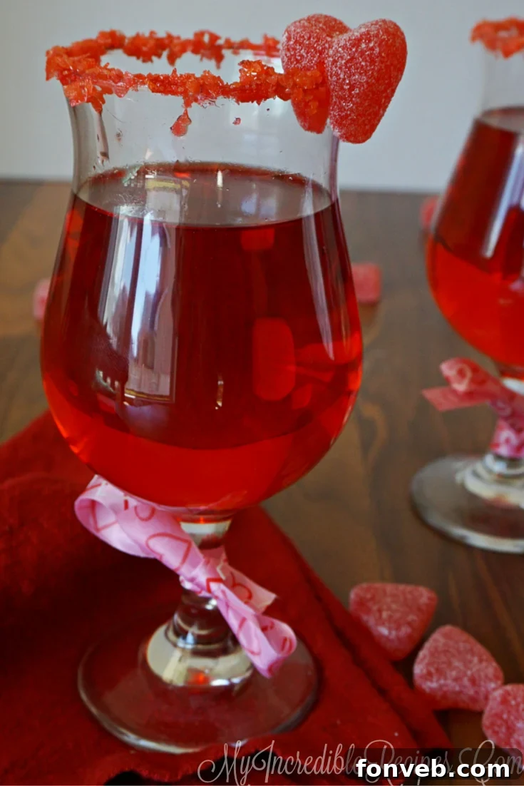 Red Hot Love Cocktail with cinnamon stick and red garnish, perfect for Valentine's Day