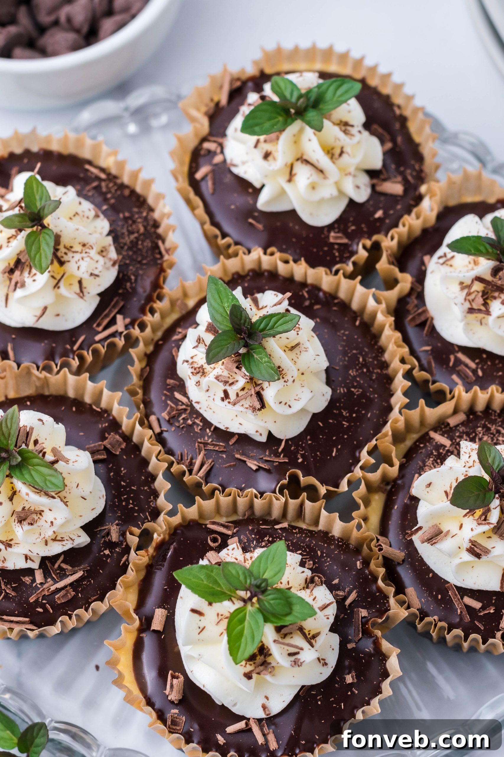 Mini Baileys cheesecake with a bite taken out, revealing the creamy layers and Oreo crust