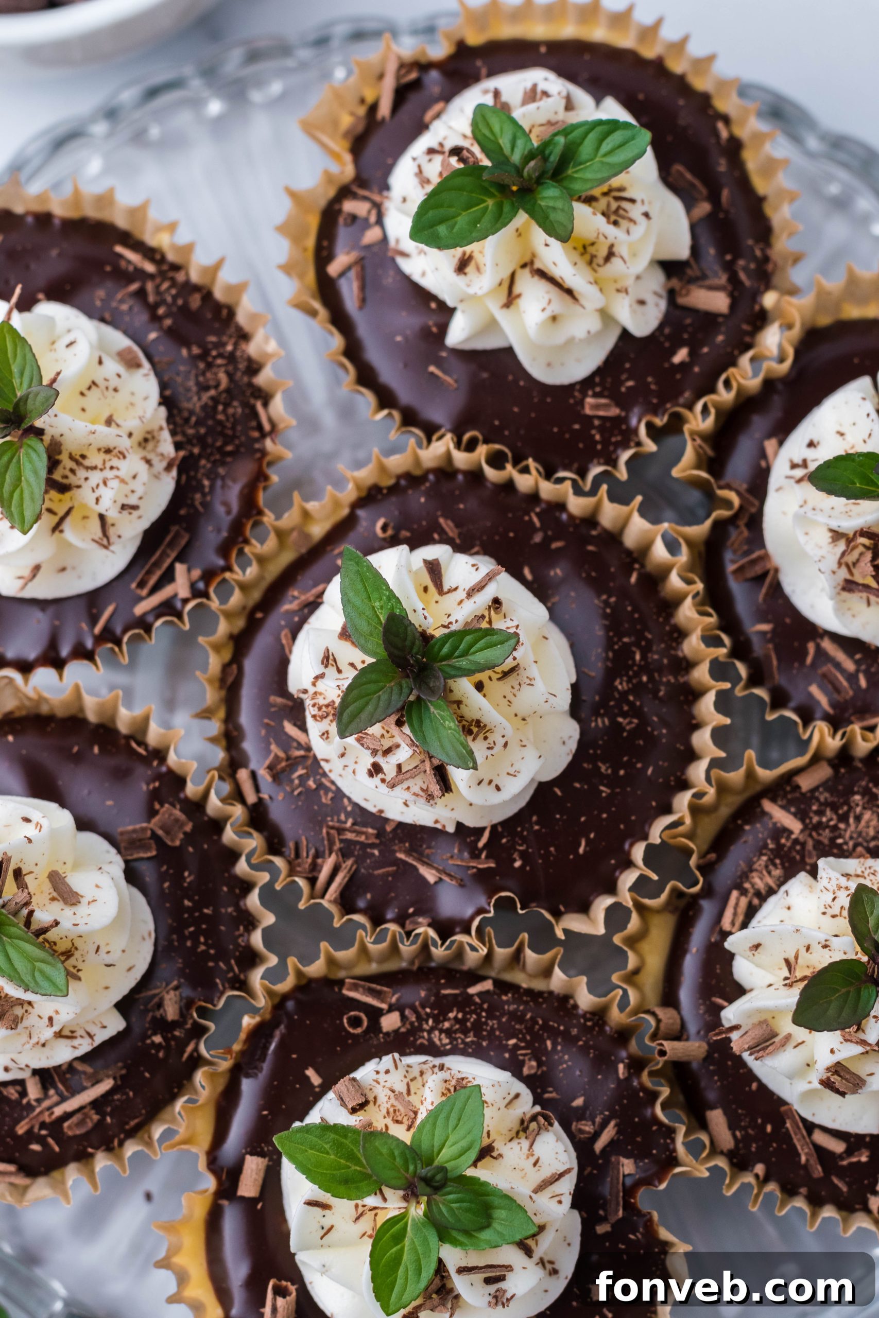 Another perspective of a mini Baileys cheesecake with a thick layer of chocolate ganache