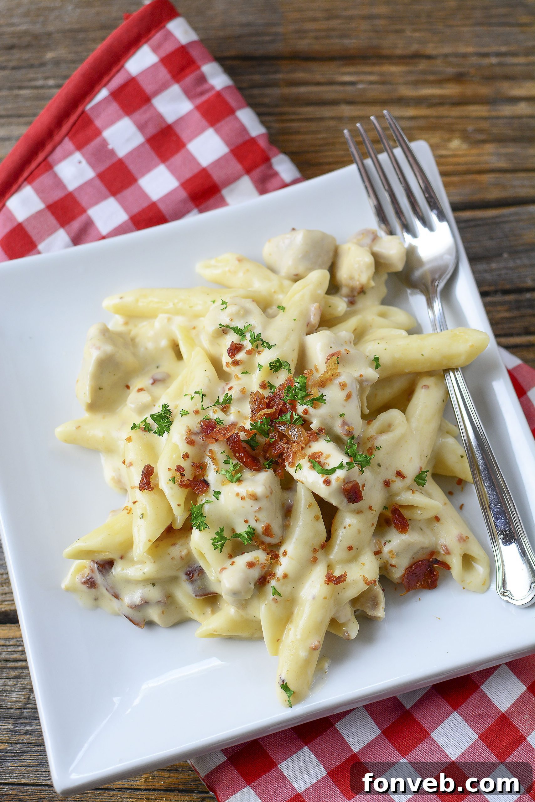 Slices of crispy, thick-cut bacon, ready to be crumbled into the pasta.