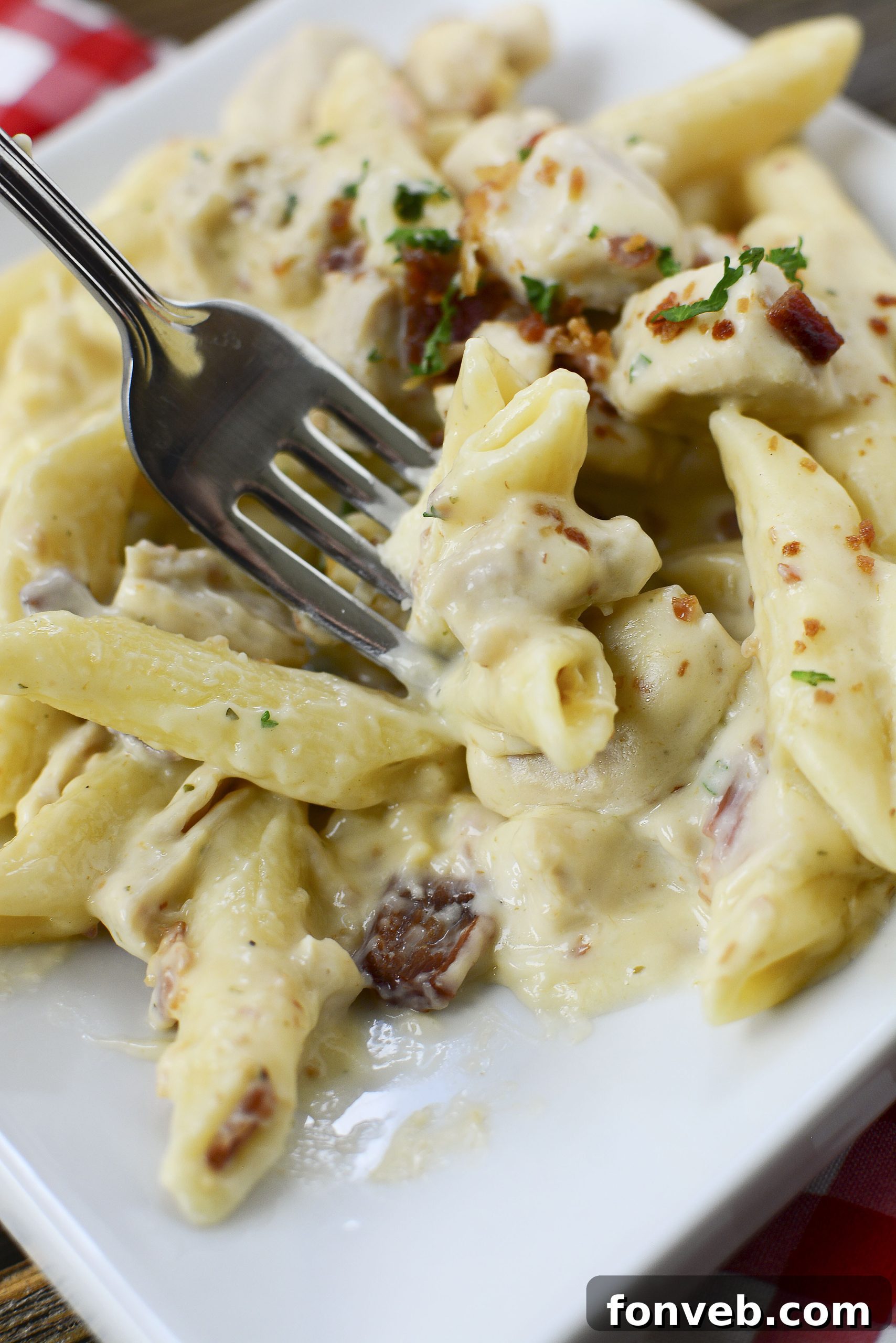 Plated Instant Pot Crack Chicken Pasta, showcasing its inviting appearance with crispy bacon on top.