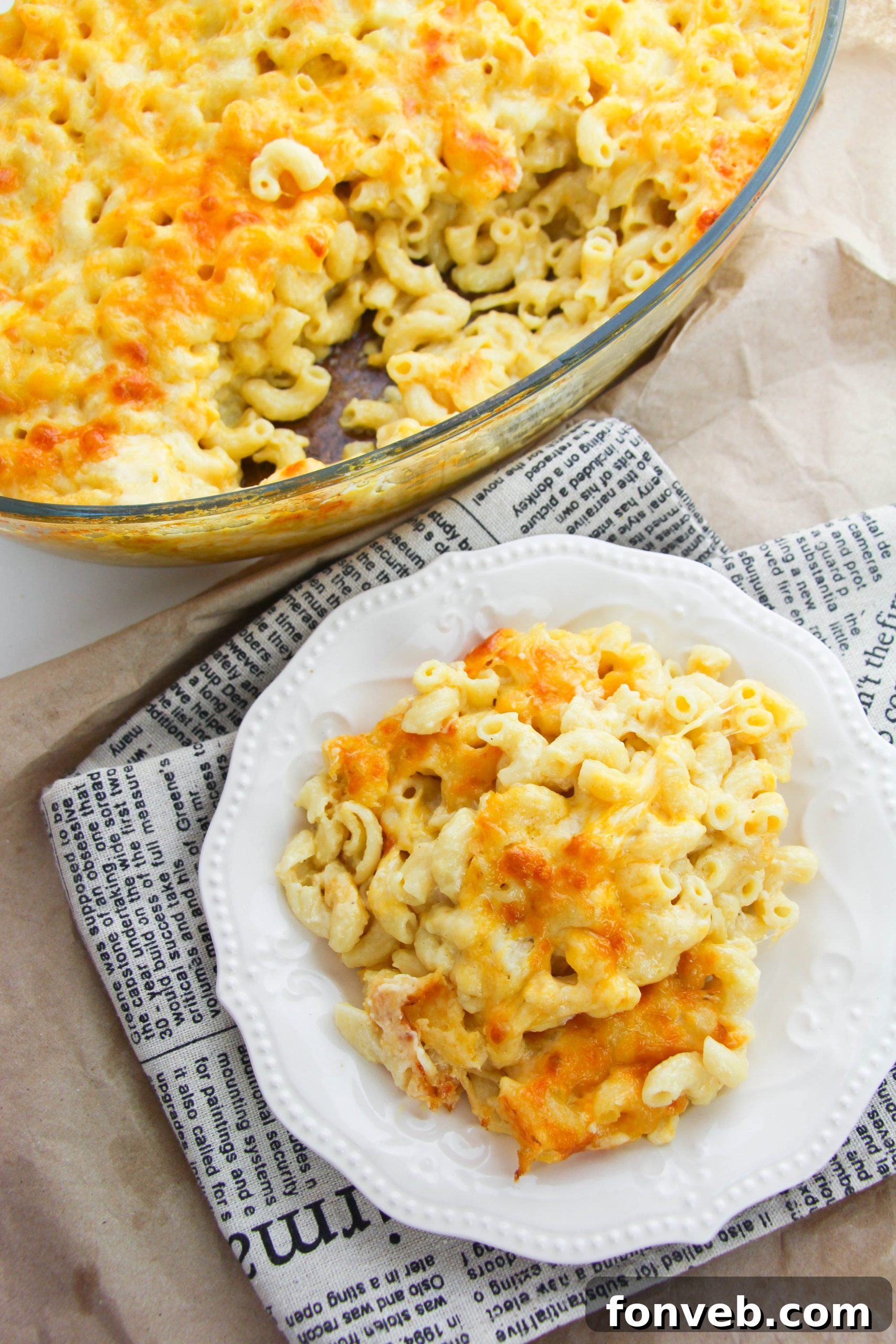 A full view of the baked macaroni and cheese, showcasing its golden topping and the generous portion in a casserole dish